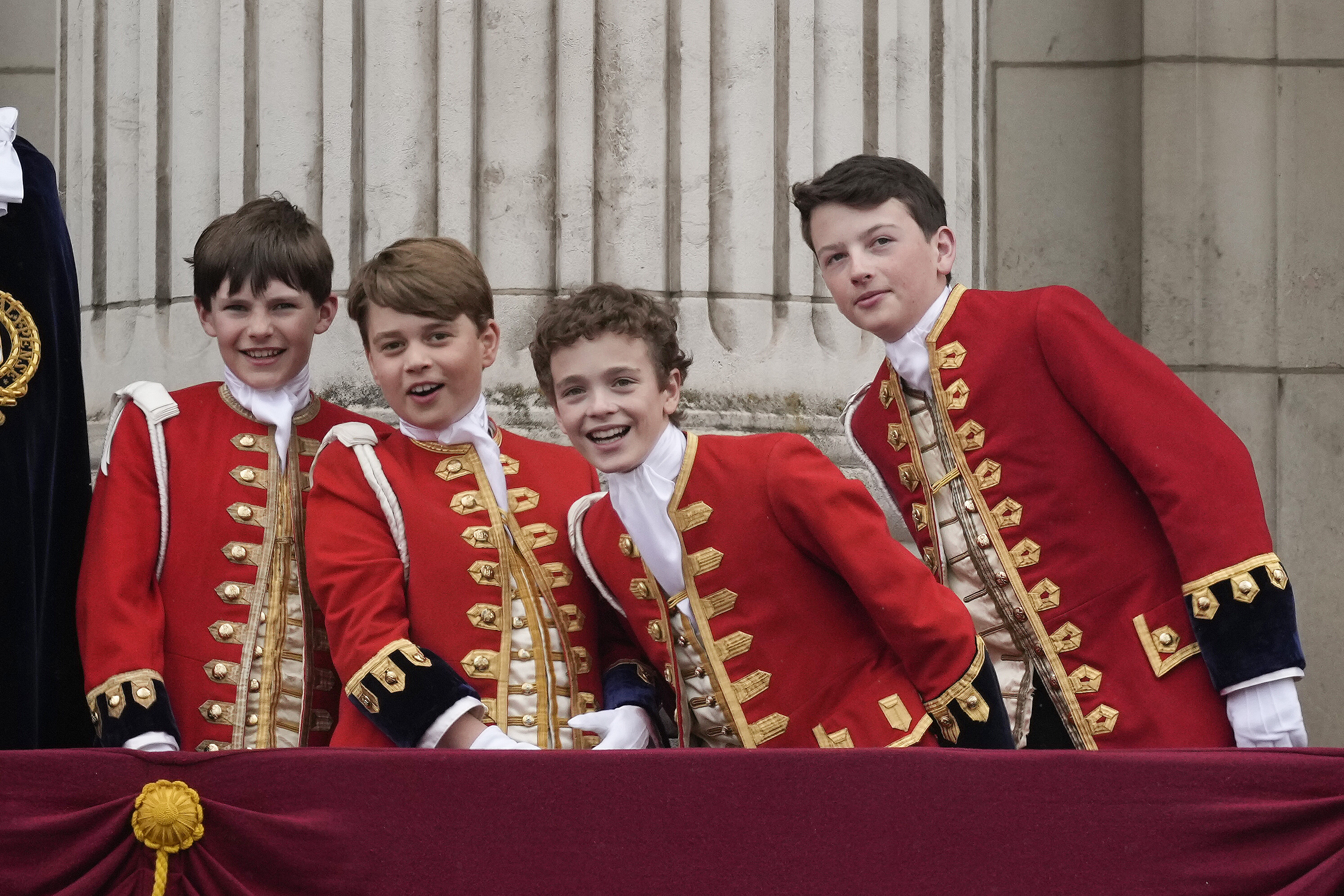 LONDON, ENGLAND - MAY 06: (L-R) Page of Honour Lord Oliver Cholmondeley, Prince George of Wales, Page of Honour Nicholas Barclay and Page of Honour Ralph Tollemache seen on the Buckingham Palace balcony during the Coronation of King Charles III and Queen Camilla on May 06, 2023 in London, England. The Coronation of Charles III and his wife, Camilla, as King and Queen of the United Kingdom of Great Britain and Northern Ireland, and the other Commonwealth realms takes place at Westminster Abbey today. Charles acceded to the throne on 8 September 2022, upon the death of his mother, Elizabeth II. (Photo by Christopher Furlong/Getty Images)
