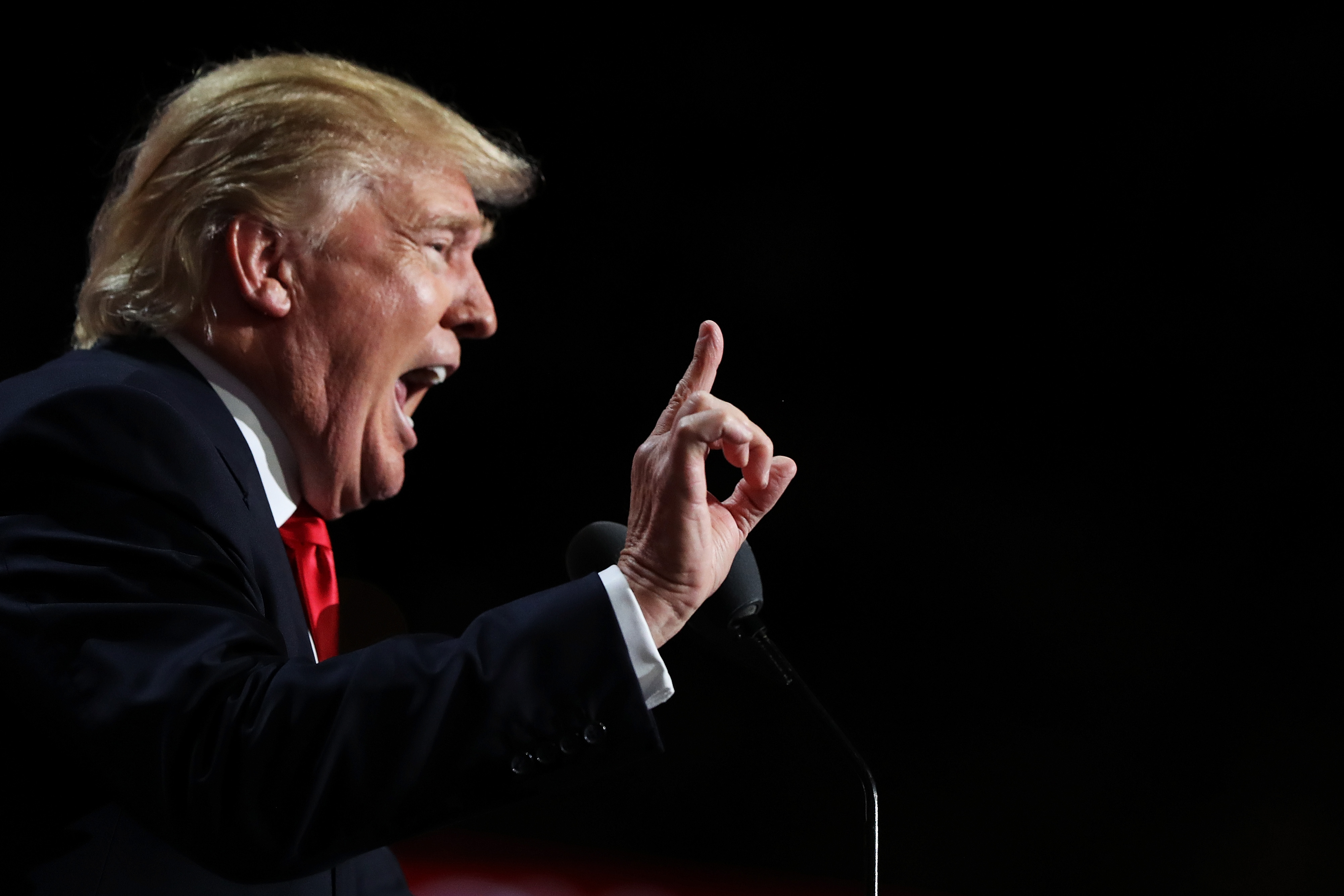 Donald Trump points to the crowd as he delivers a speech during the evening session on the fourth day of the Republican National Convention on July 21, 2016 at the Quicken Loans Arena in Cleveland, Ohio. Republican presidential candidate Donald Trump received the number of votes needed to secure the party's nomination. An estimated 50,000 people are expected in Cleveland, including hundreds of protesters and members of the media. The four-day Republican National Convention kicked off on July 18. (Photo by Joe Raedle/Getty Images)