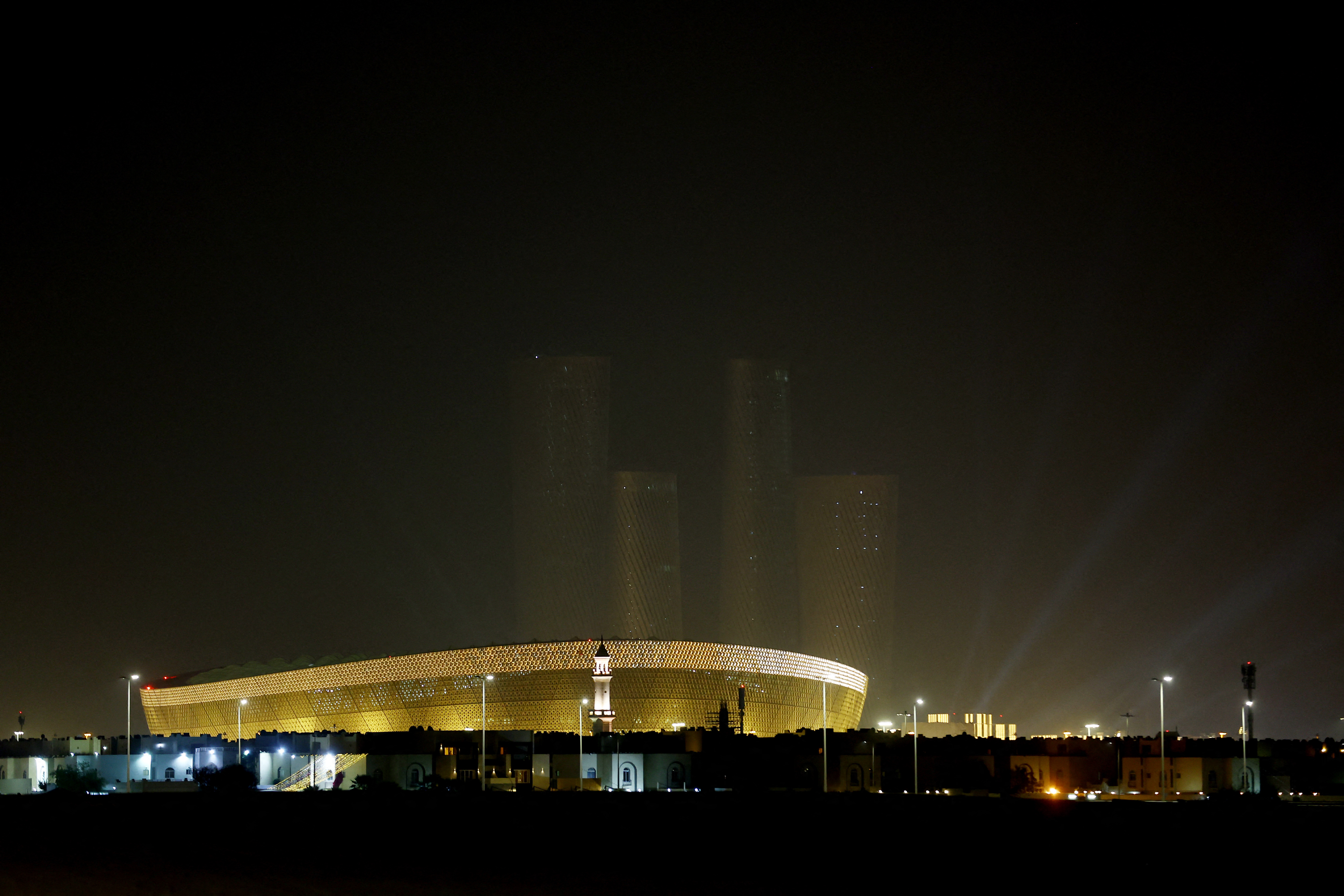 Soccer Football - FIFA World Cup Qatar 2022 - Lusail Stadium, Lusail, Qatar - December 17, 2022 General view at night of the Lusail Stadium and Lusail Plaza Towers ahead of the final between Argentina and France REUTERS/Carl Recine
