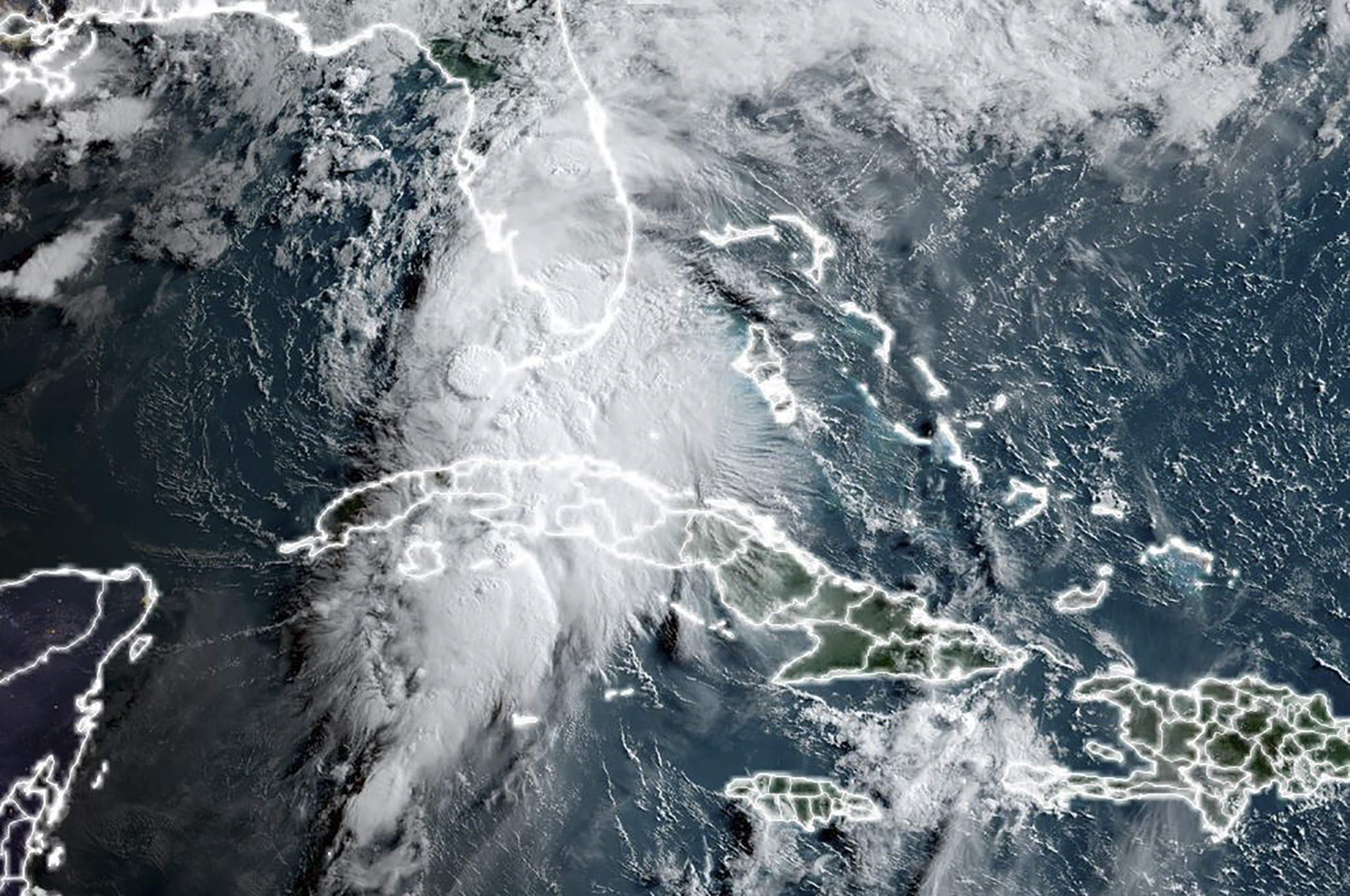 This National Oceanic and Atmospheric Administration (NOAA) satellite image taken at 12:00 UTC on July 6, 2021 shows Tropical Storm Elsa moving towards the US state of Florida after moving up from Cuba in the Caribbean. - Tropical storm Elsa was moving over the Florida Straits toward the southern US state Tuesday after battering Cuba with drenching rain and strong winds, but left the Caribbean island without major damage.The US National Hurricane Center reported the storm was now making its way towards the west coast of Florida at 12 miles (19 kilometers) per hour with "conditions beginning to deteriorate across" the Florida Keys, the archipelago at the state's southern tip.A hurricane watch has been issued "for portions of the west coast of Florida," the NHC said in its latest advisory at 5 am (0900 GMT). (Photo by Handout / NASA/NOAA / AFP) / RESTRICTED TO EDITORIAL USE - MANDATORY CREDIT "AFP PHOTO / NOAA/CIRA/RAMMB / HANDOUT " - NO MARKETING - NO ADVERTISING CAMPAIGNS - DISTRIBUTED AS A SERVICE TO CLIENTS