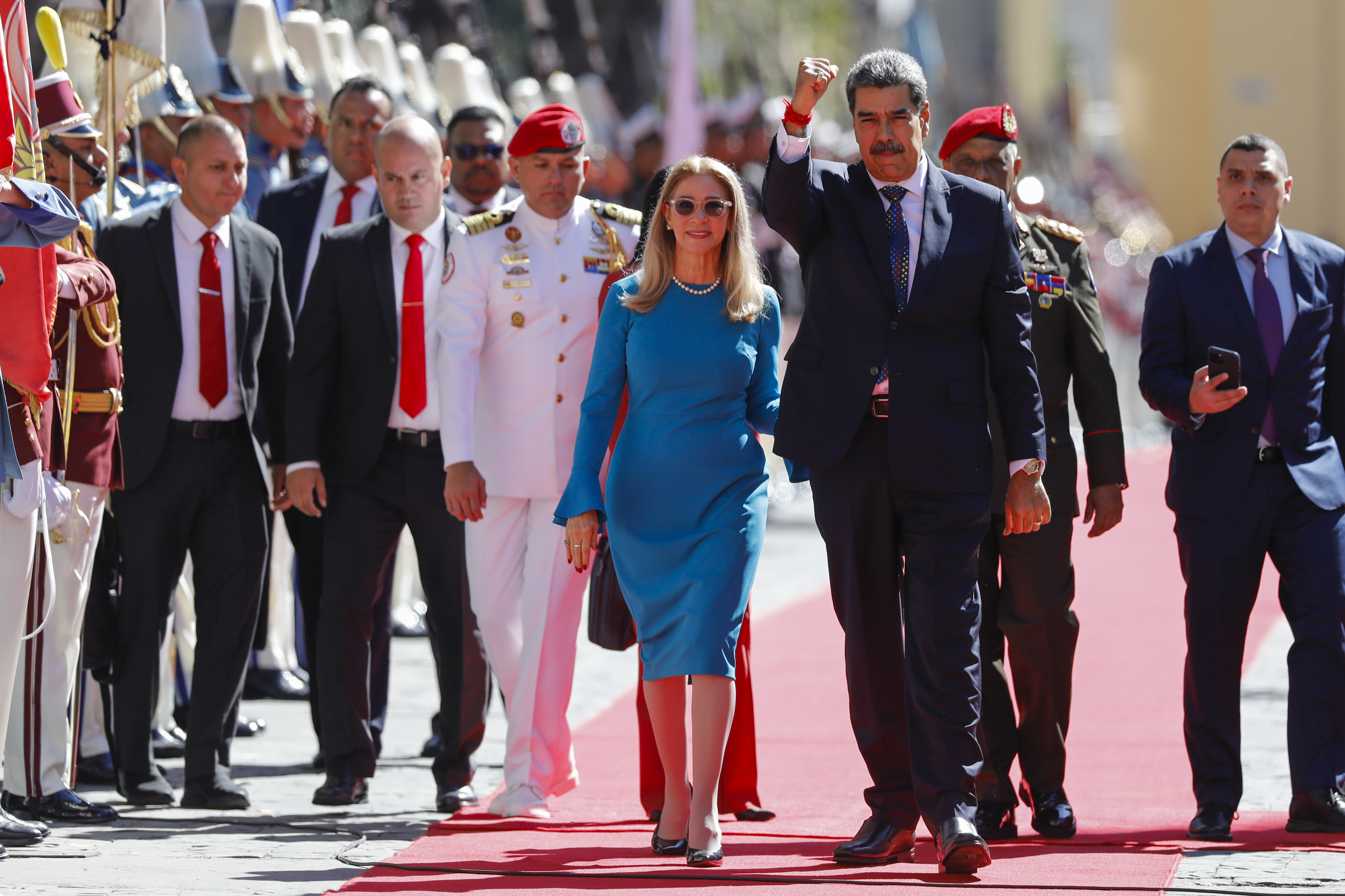 Venezuelan President Nicolas Maduro and his wife Cilia Flores arrive at the National Assembly for his swearing-in ceremony for a third term in Caracas, Venezuela, Friday, Jan. 10, 2025. (AP Photo/Cristian Hernandez)