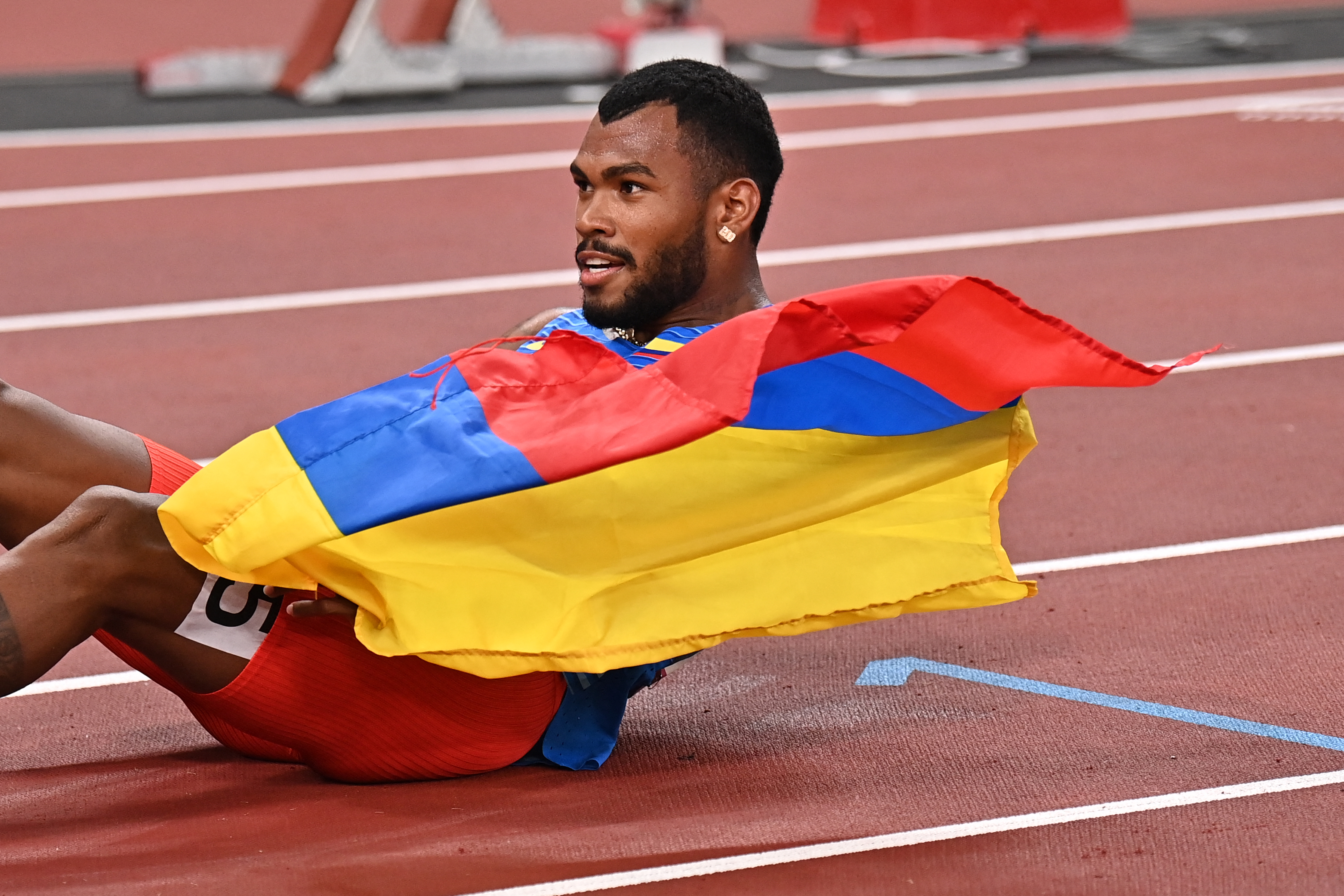 Silver medallist Colombia's Anthony Jose Zambrano celebrates after the men's 400m final during the Tokyo 2020 Olympic Games at the Olympic Stadium in Tokyo on August 5, 2021. (Photo by Ben STANSALL / AFP)