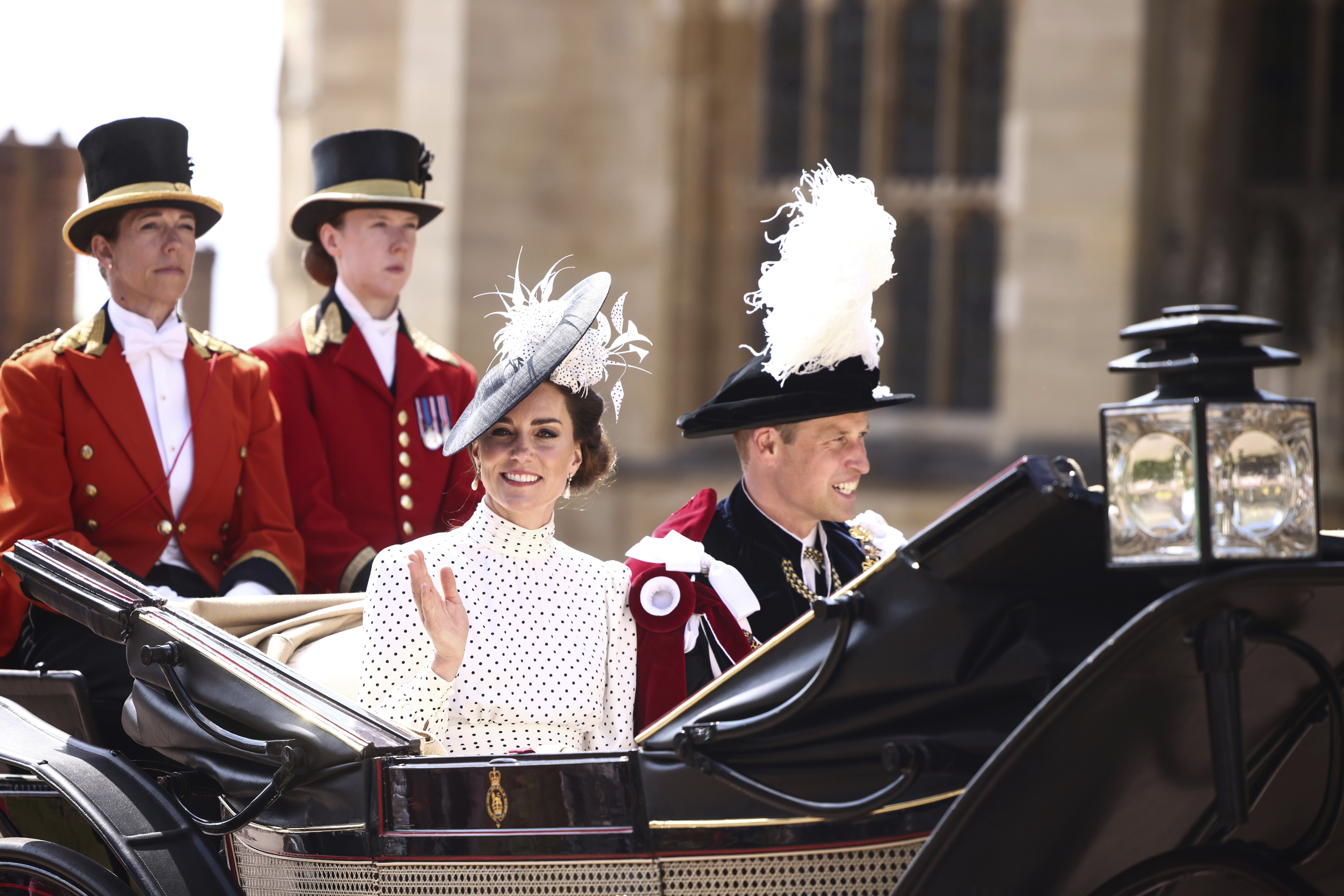 Britain's Kate, Princess of Wales and Prince William leave in a horse-drawn carriage from St George's Chapel after attending the Most Noble Order of the Garter Ceremony in Windsor Castle in Windsor, England, Monday June 19, 2023. (Henry Nicholls/Pool Photo via AP)
