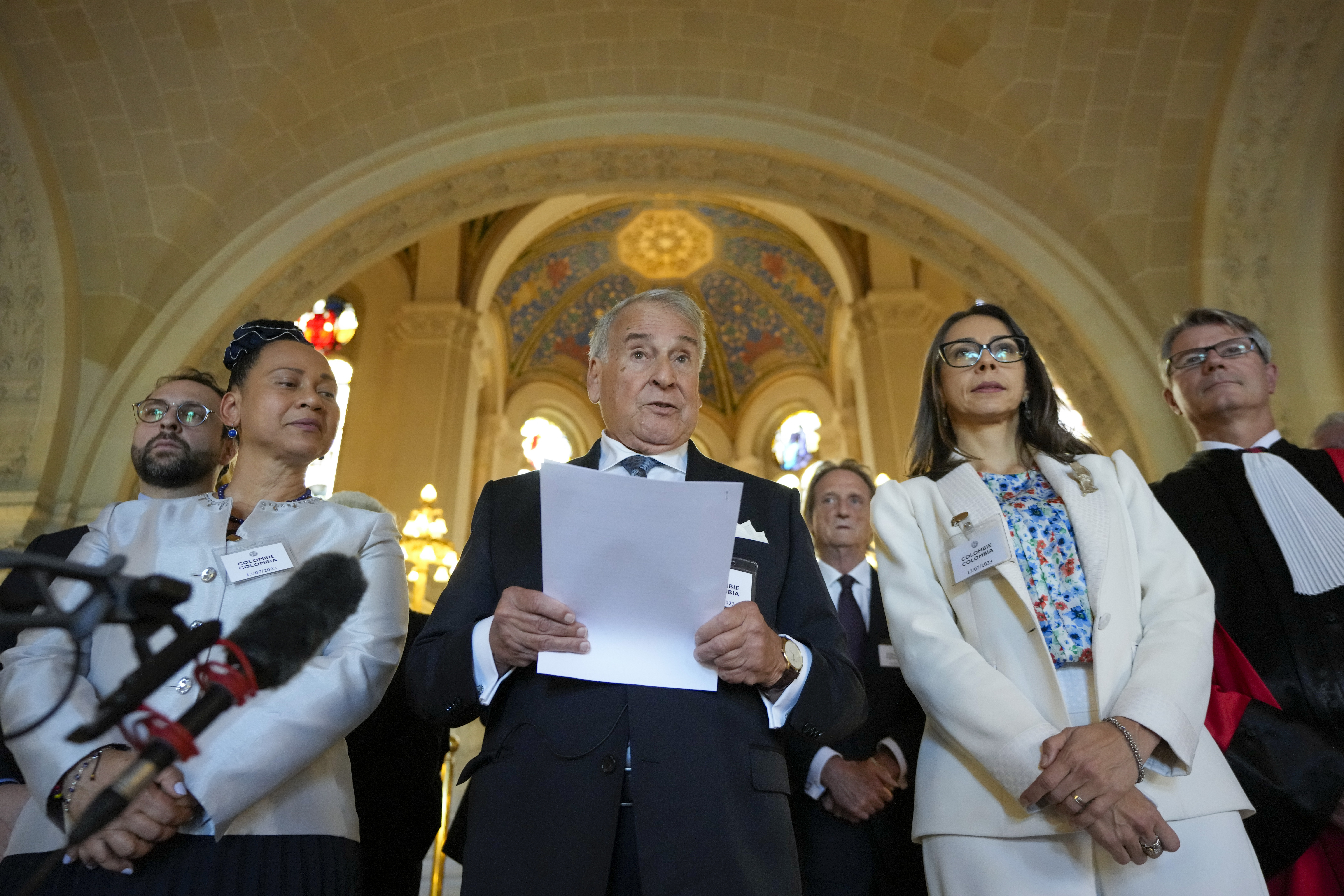 Colombia's agent Eduardo Valencia Ospina, center, and his delegation give a statement at the World Court in The Hague, Netherlands, Thursday, July 13, 2023, where the United Nations' top court rejected a case brought by Nicaragua in a decades-long maritime and sovereignty dispute in the Caribbean with neighboring Colombia. (AP Photo/Peter Dejong)