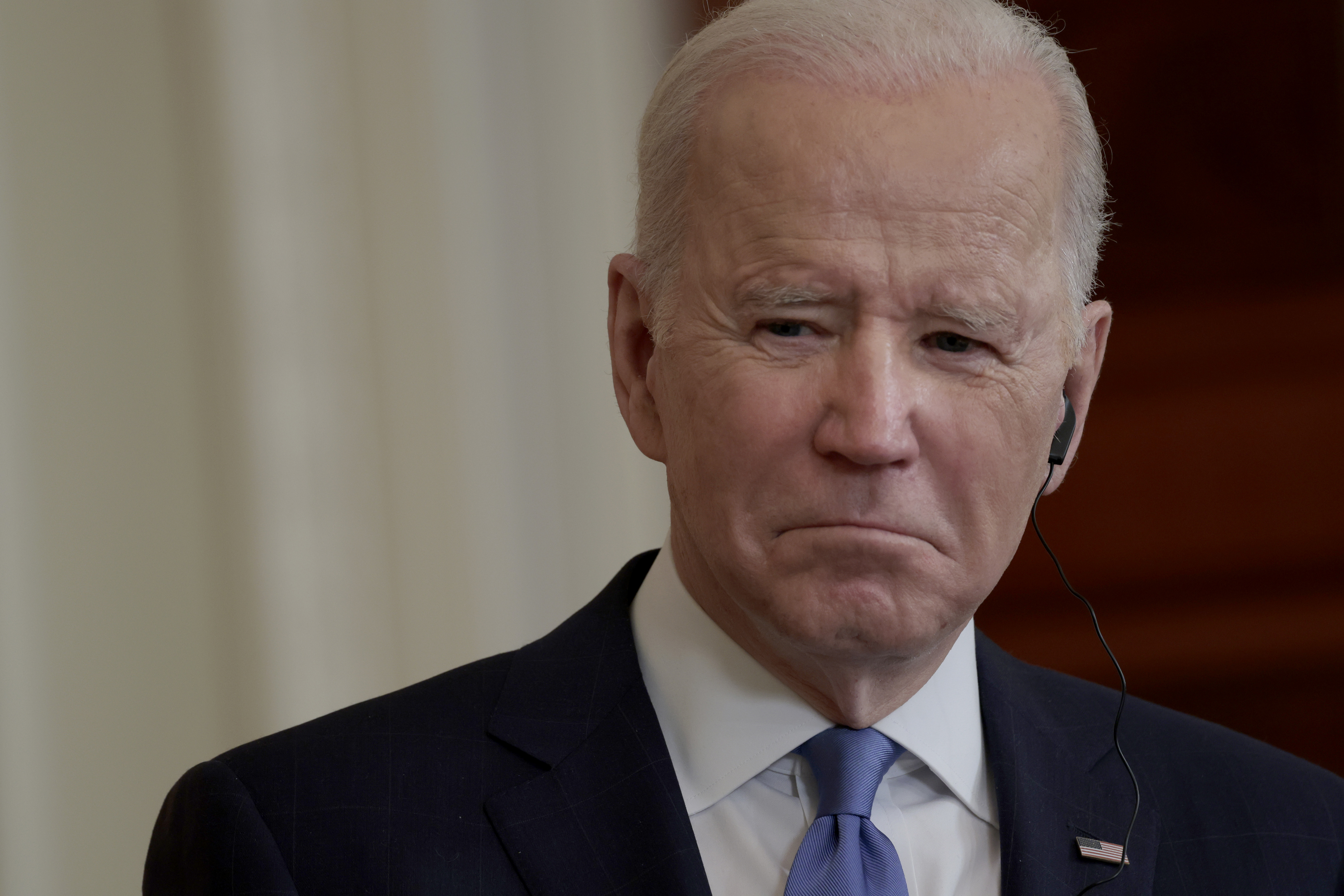 WASHINGTON, DC - FEBRUARY 07: U.S. President Joe Biden listens as German Chancellor Olaf Scholz delivers remarks alongside during a joint news conference in the East Room of the White House on February 07, 2022 in Washington, DC. This marks the first official visit to Washington for Scholz as he is expected to be pressed on Germany's stance on sanctions against Russia should they invade Ukraine. (Photo by Anna Moneymaker/Getty Images)