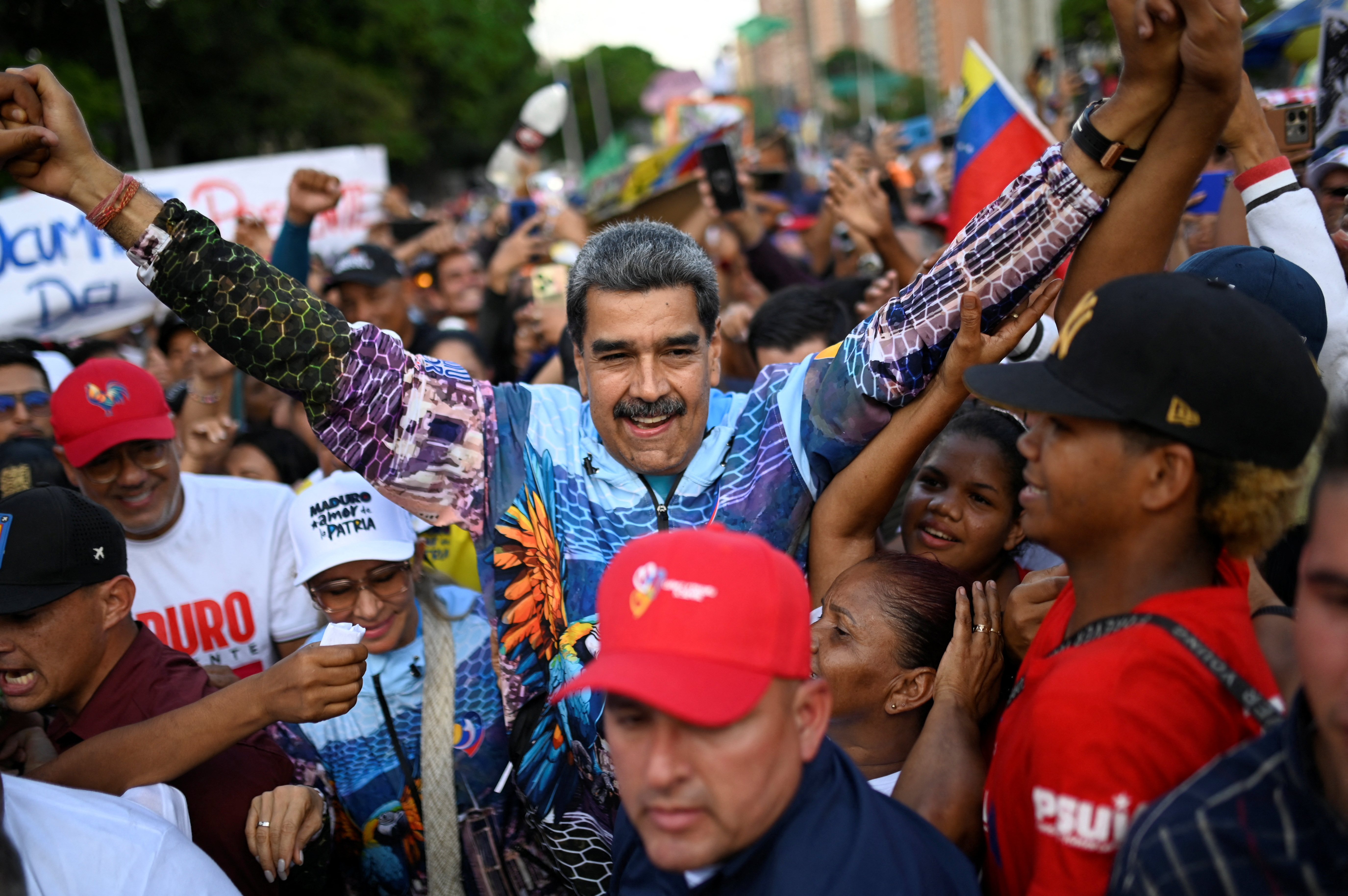 Venezuela's President Nicolas Maduro is greeted by supporters on the opening day of the presidential election campaign, in Caracas, Venezuela July 4, 2024. REUTERS/Maxwell Briceno