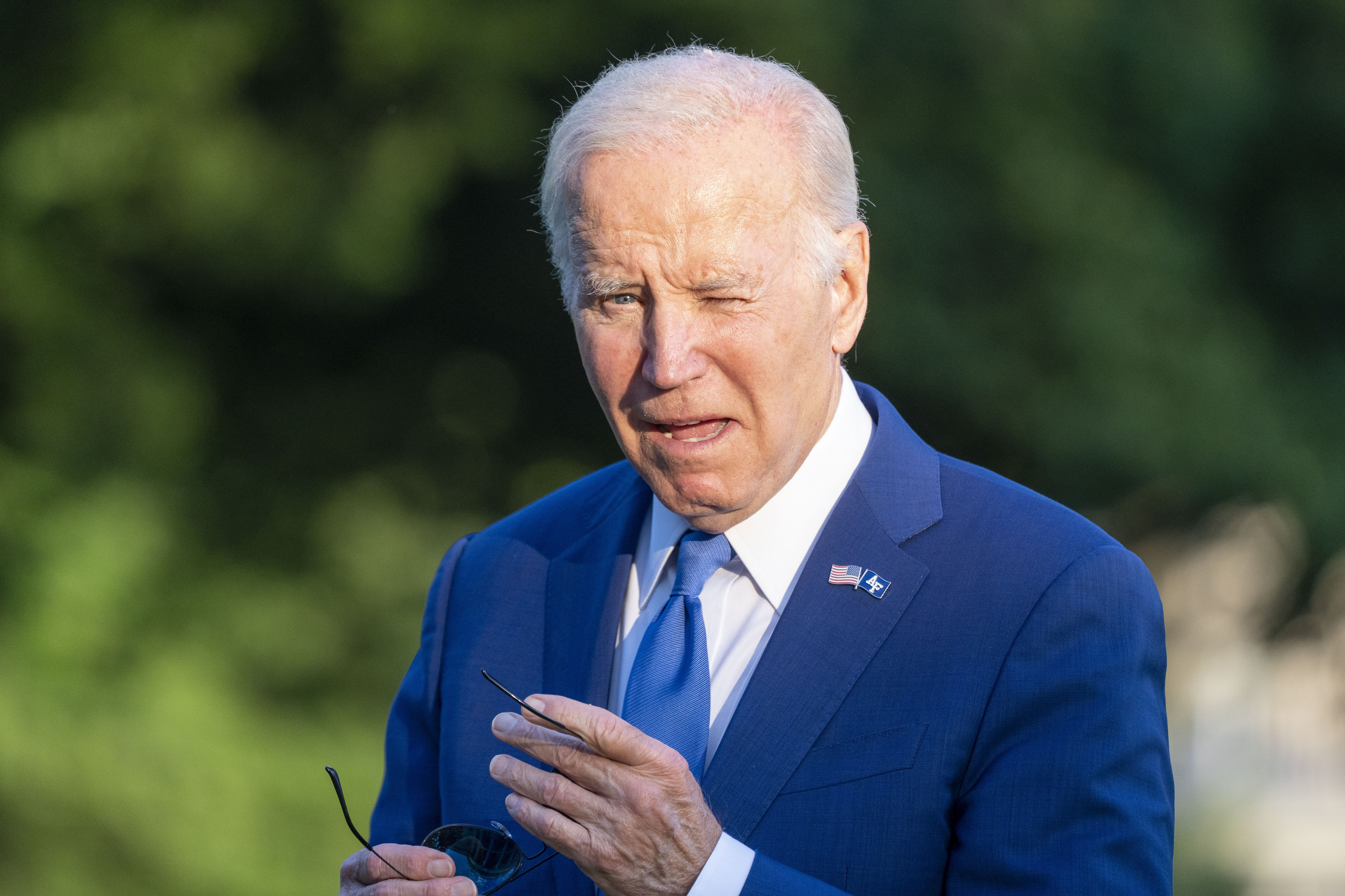 President Joe Biden squints into the sun as he walks from Marine One upon arrival on the South Lawn of the White House, Thursday, June 1, 2023, in Washington. Biden is returning from Colorado. (AP Photo/Alex Brandon)