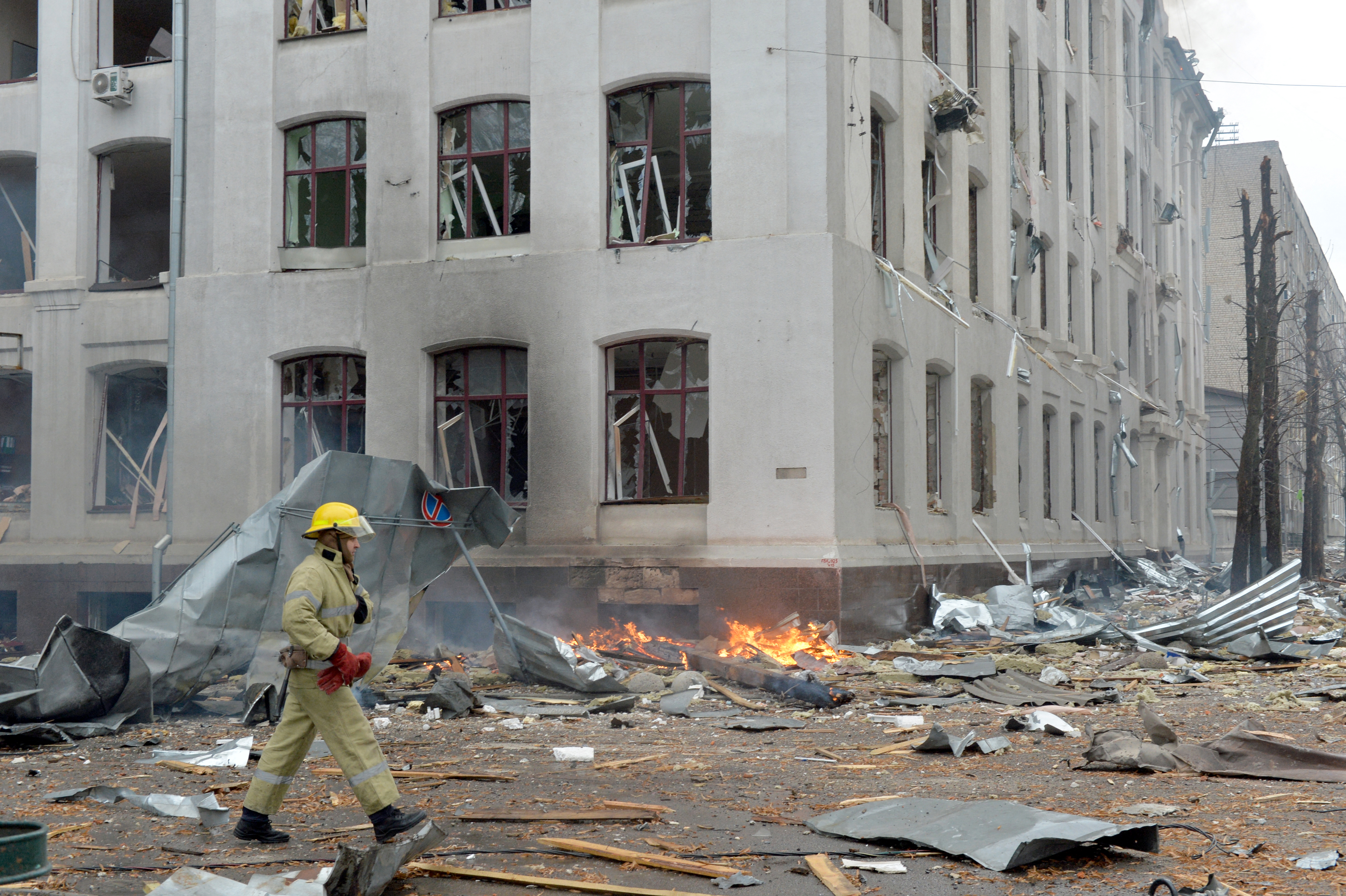 Firefighters work to contain a fire at the Economy Department building of Karazin Kharkiv National University, allegedly hit during recent shelling by Russia, in Kharkiv on March 2, 2022. (Photo by Sergey BOBOK / AFP)