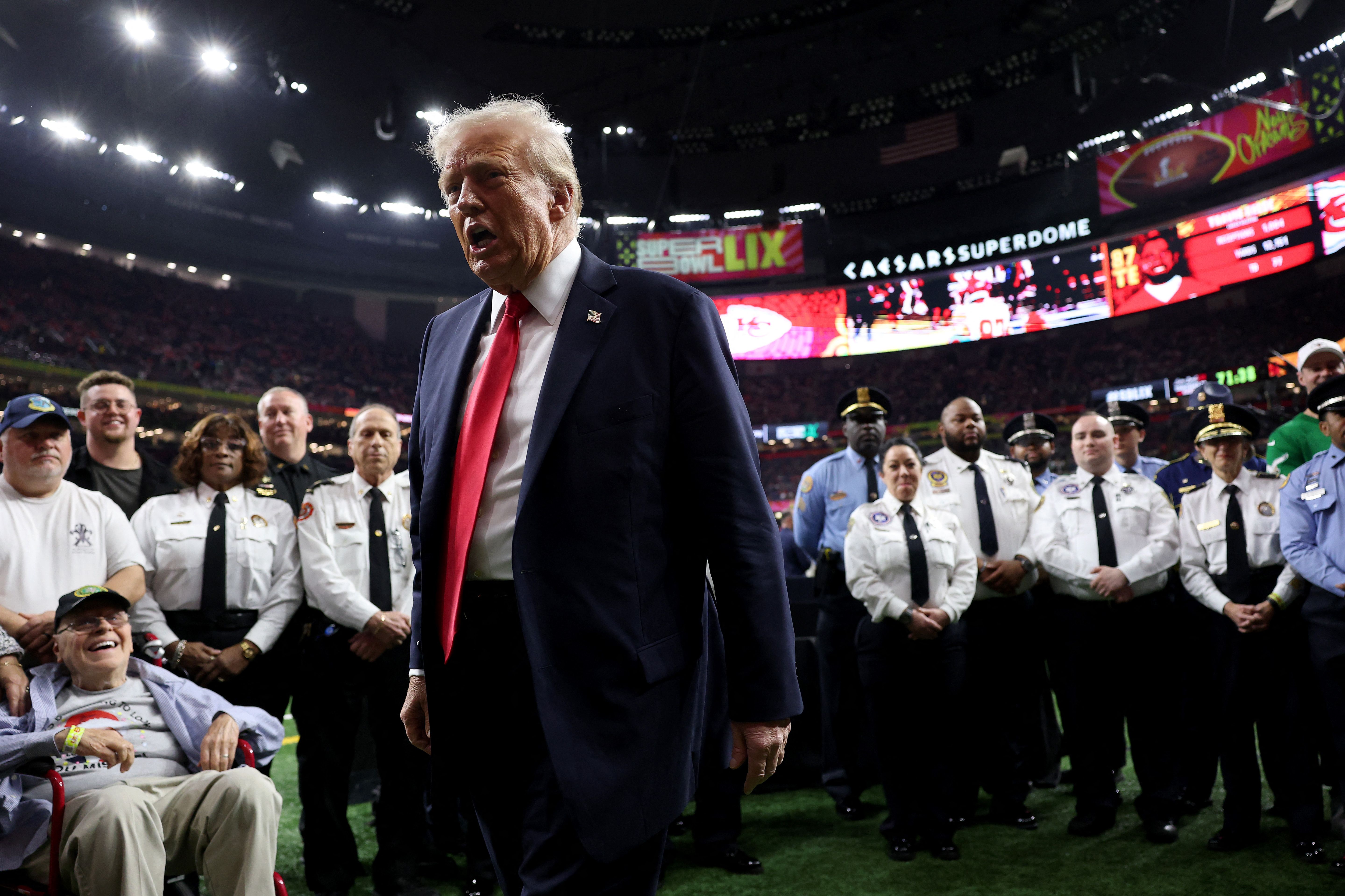 NEW ORLEANS, LOUISIANA - FEBRUARY 09: U.S. President Donald Trump reacts after posing with family members of victims in the January 1 attack on Bourbon Street and emergency responders prior to Super Bowl LIX between the Kansas City Chiefs and the Philadelphia Eagles at Caesars Superdome on February 09, 2025 in New Orleans, Louisiana. Jamie Squire/Getty Images/AFP (Photo by JAMIE SQUIRE / GETTY IMAGES NORTH AMERICA / Getty Images via AFP)