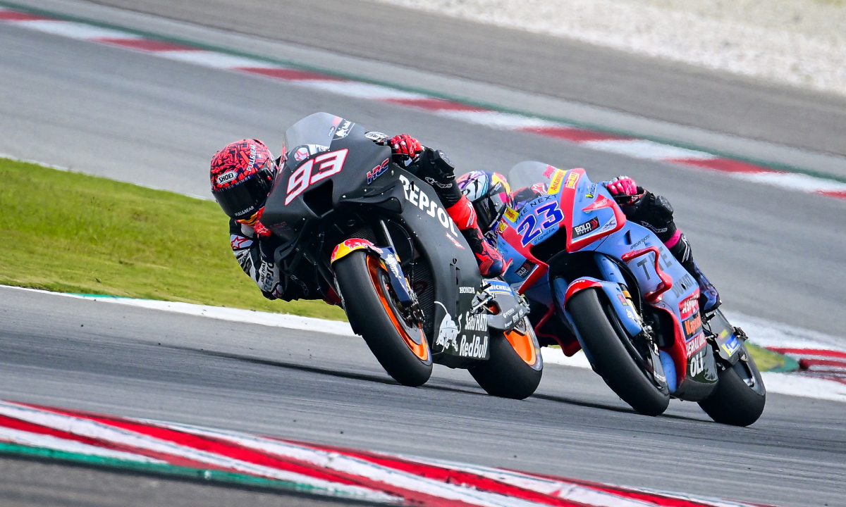 Repsol Honda Team's Spanish rider Marc Marquez (L) and Gresini Racing MotoGP's Italian Enea Bastianini take a corner during the second day of the pre-season MotoGP winter test at the Sepang International Circuit in Sepang on February 6, 2022.
Ahmad Fadali / AFP