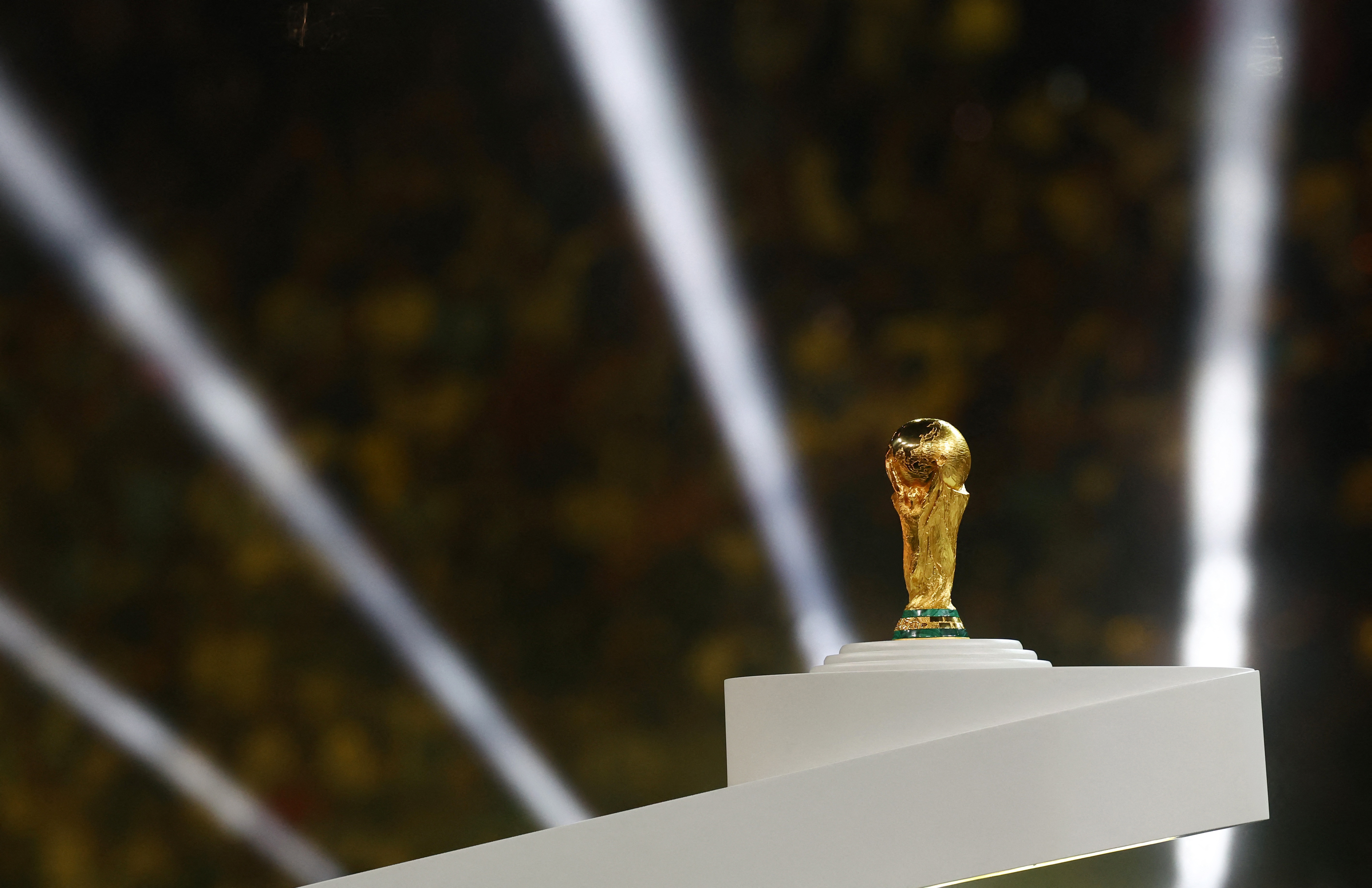 Soccer Football - FIFA World Cup Qatar 2022 - Final - Argentina v France - Lusail Stadium, Lusail, Qatar - December 18, 2022 General view of the World Cup trophy on a plinth before the trophy presentation REUTERS/Kai Pfaffenbach
