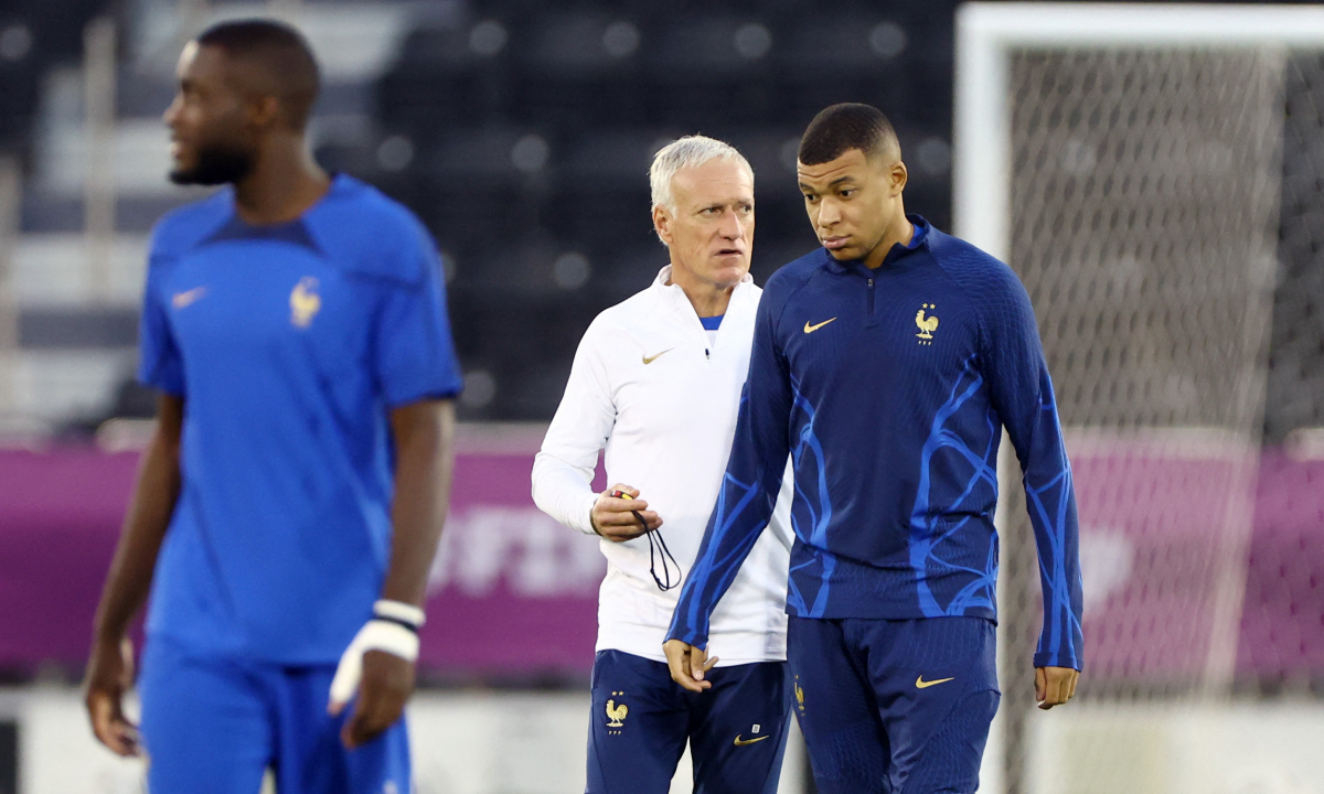 Soccer Football - FIFA World Cup Qatar 2022 - France Training - Al Sadd SC Stadium, Doha, Qatar - December 17, 2022 France coach Didier Deschamps and Kylian Mbappe during training REUTERS/Hannah Mckay