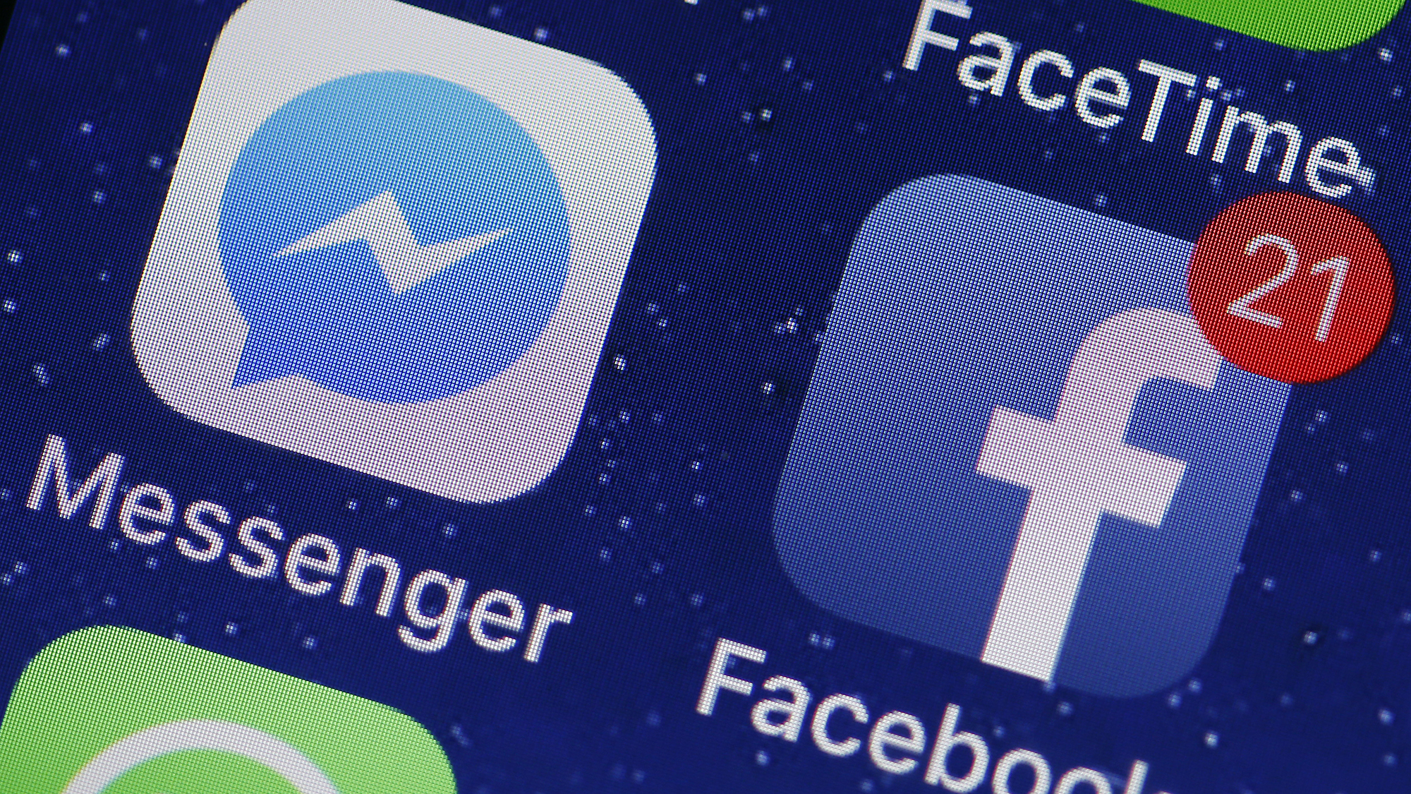 PARIS, FRANCE - APRIL 06:  In this photo illustration, the logo of the Messenger and Facebook applications are displayed on the screen of an Apple iPhone on April 06, 2018 in Paris. In the midst of turmoil following the Cambridge Analytica scandal, Facebook faces a host of questions regarding its privacy and confidentiality practices. Messenger, the messaging application launched by Facebook, is in the center of attention. Indeed, Facebook allows itself to analyze the links and images that users send to Messenger and even to read the messages exchanged if they are posted, in order to make sure that the contents comply with the conditions of use. This increased monitoring of Facebook within its messaging application was confirmed by Mark Zuckerberg a few days ago.(Photo Illustration by Chesnot/Getty Images)