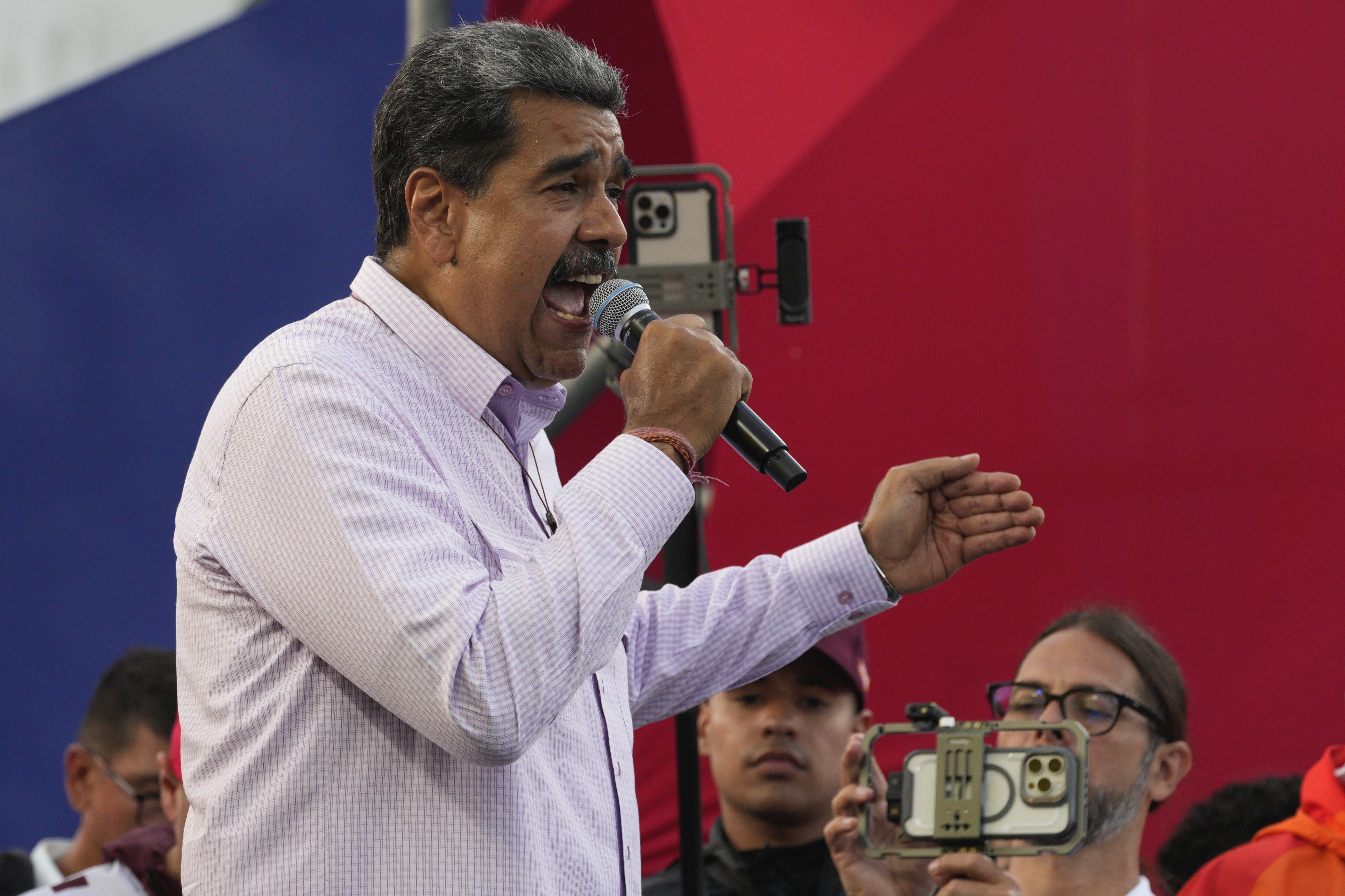 Venezuelan President Nicolas Maduro speaks to supporters during a campaign rally on the Boulevard of Coche in Caracas, Venezuela, Monday, July 8, 2024. (AP Photo/Ariana Cubillos)