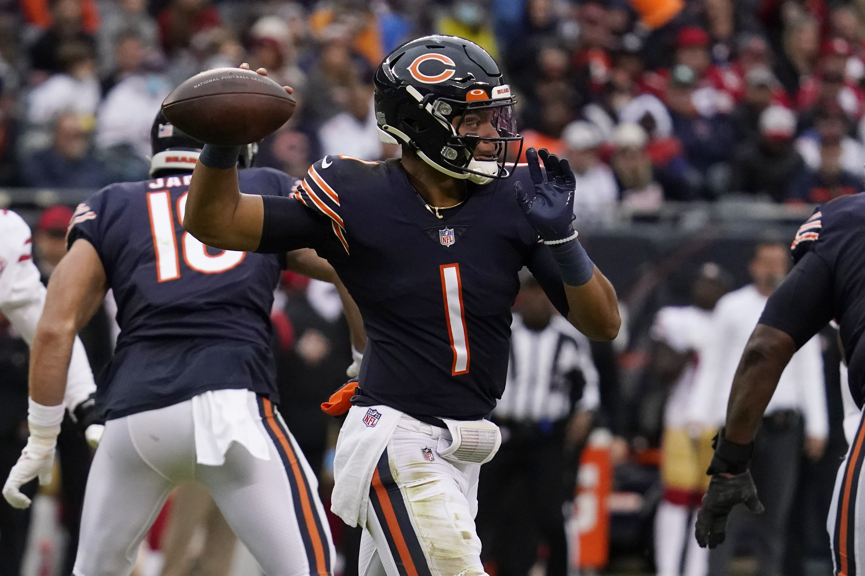 Chicago Bears outside linebacker Robert Quinn strips the ball from  Baltimore Ravens quarterback …