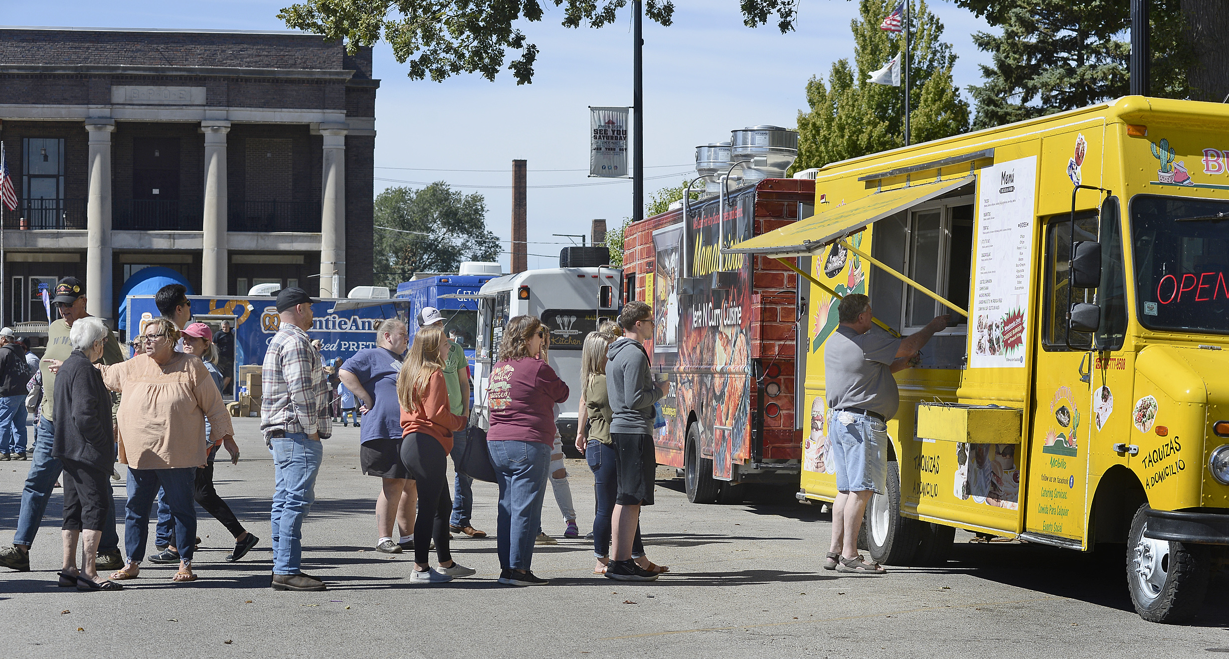 Visitors lined up for several different food offerings Saturday, Sept. 25, 2021, during the Food Truck Festival at City Park in Streator. The festival was sponsored by Streatscapes, the same group responsible for Walldogs.