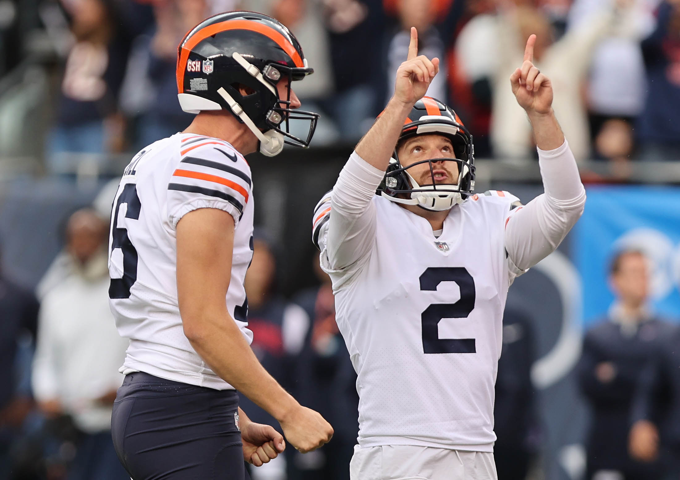 Cairo Santos of the Chicago Bears celebrates with Trenton Gill