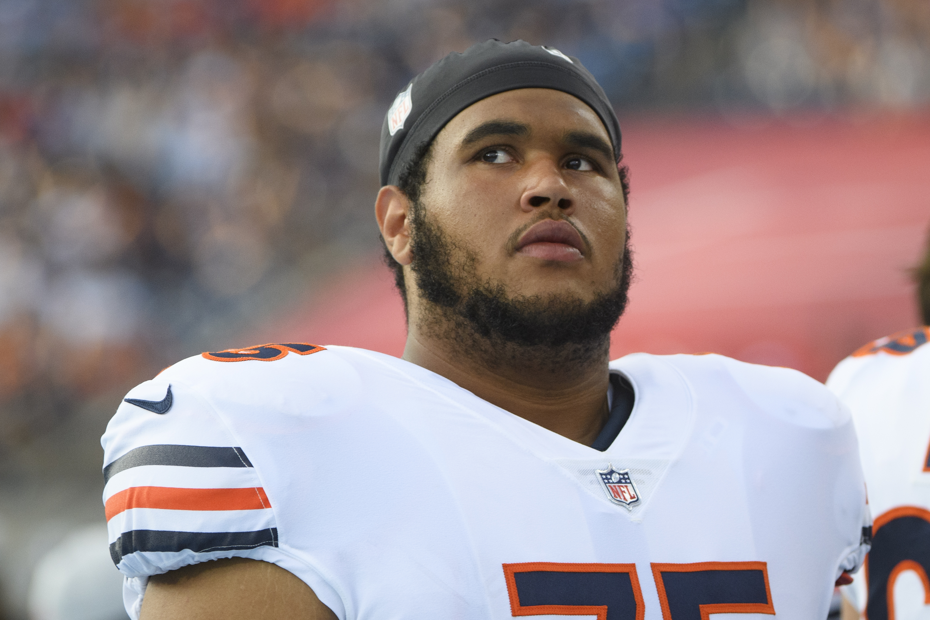 Chicago Bears offensive tackle Larry Borom (75) looks on during