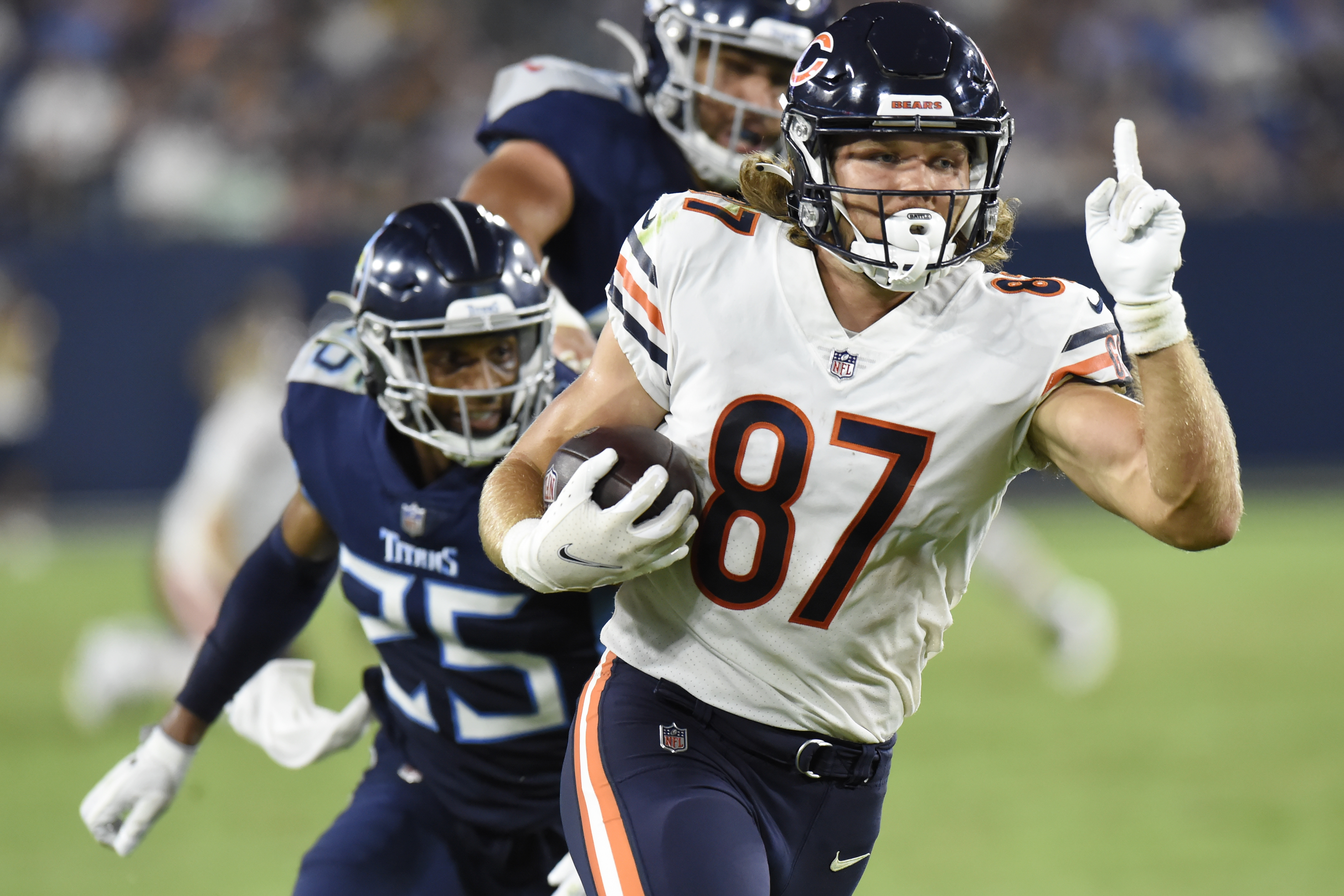 Chicago Bears defensive back Tre Roberson, left, scores a touchdown after  intercepting a pass against the Tennessee Titans in the first half of a  preseason NFL football game Saturday, Aug. 28, 2021