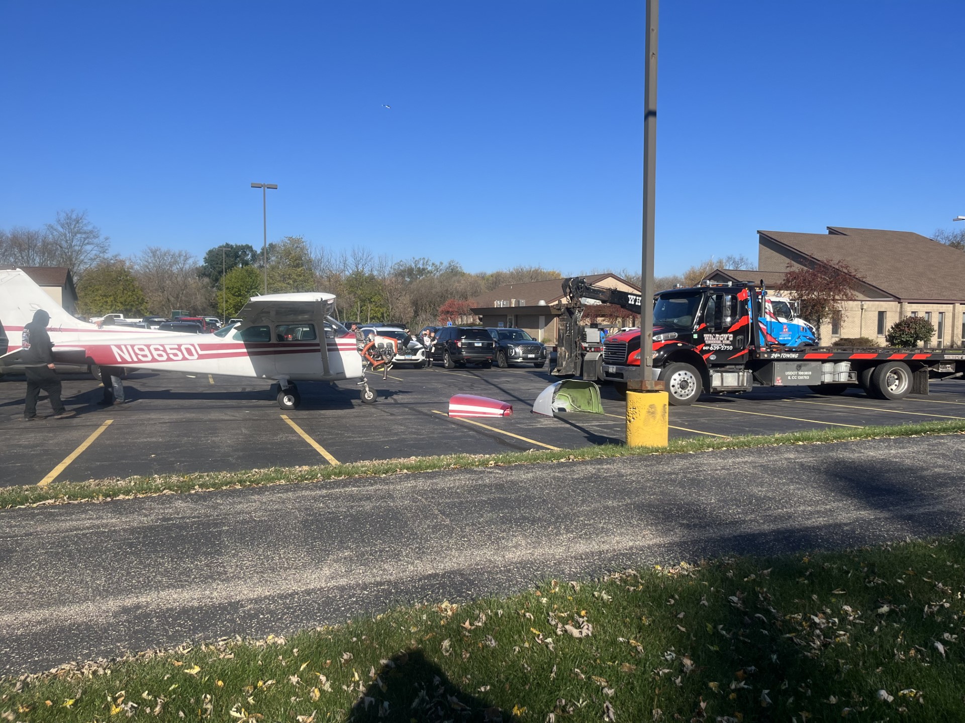 Small plane crashes into car during emergency landing in North