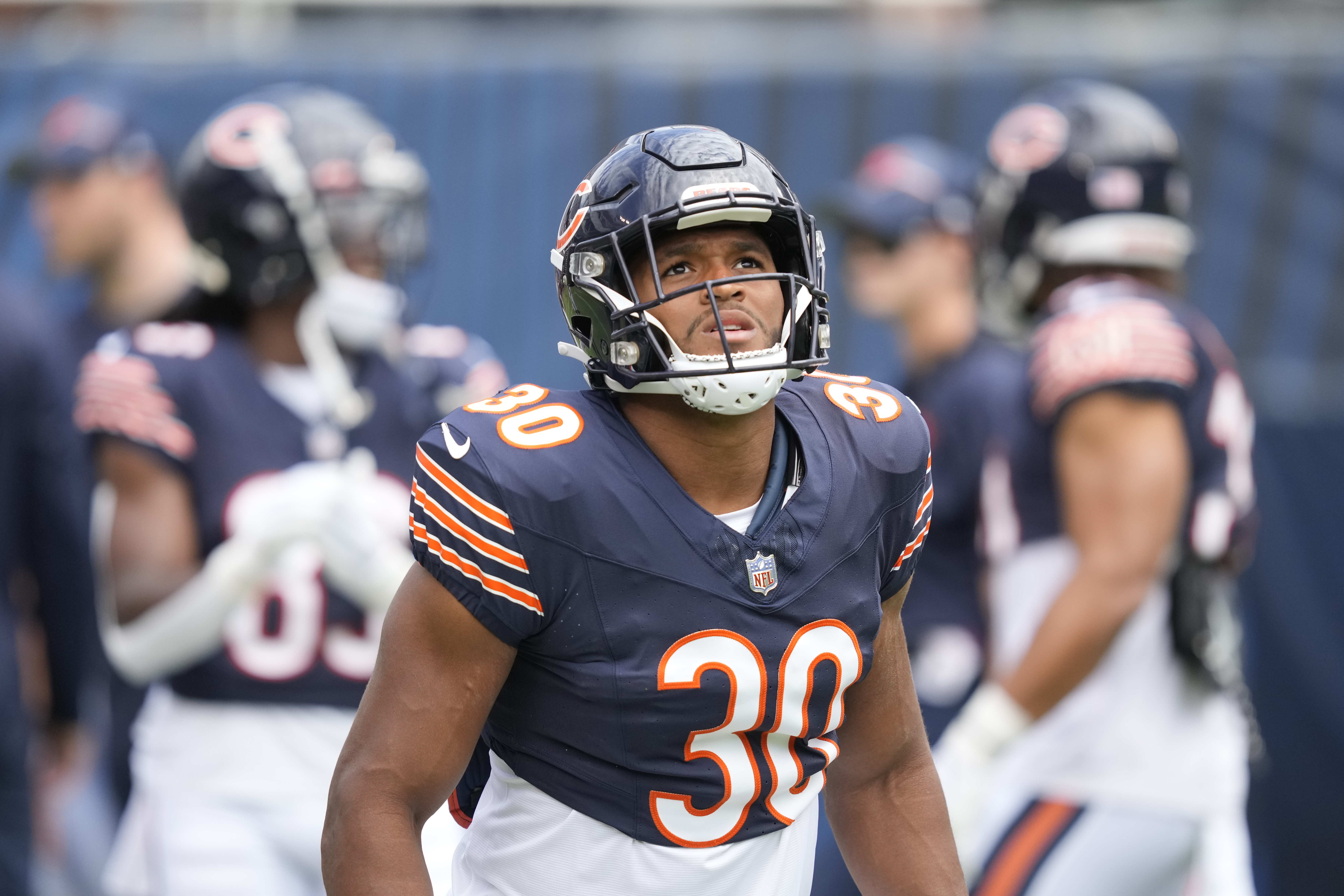 Chicago Bears running back Khalil Herbert (24) warms up prior to