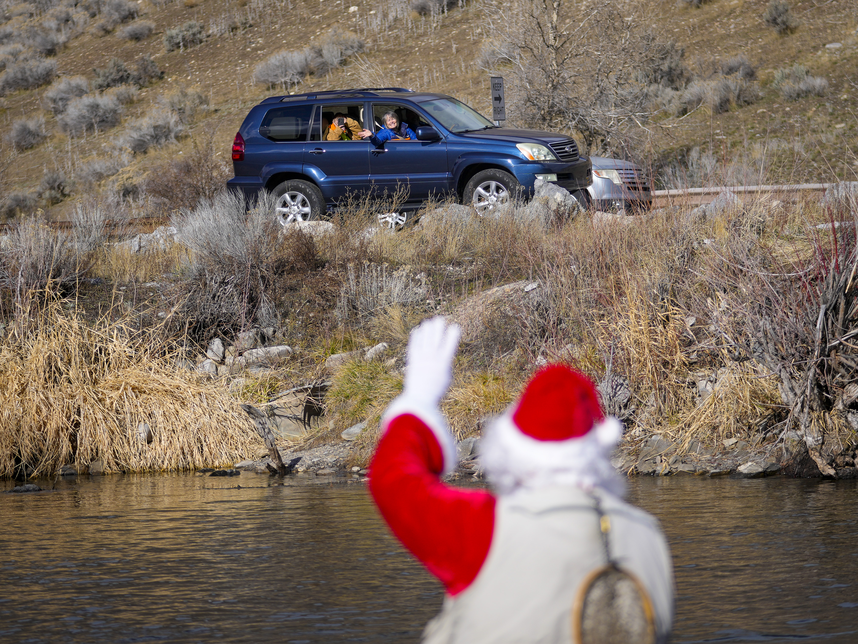 Utahn dressed as Santa Claus goes fly fishing in Provo River