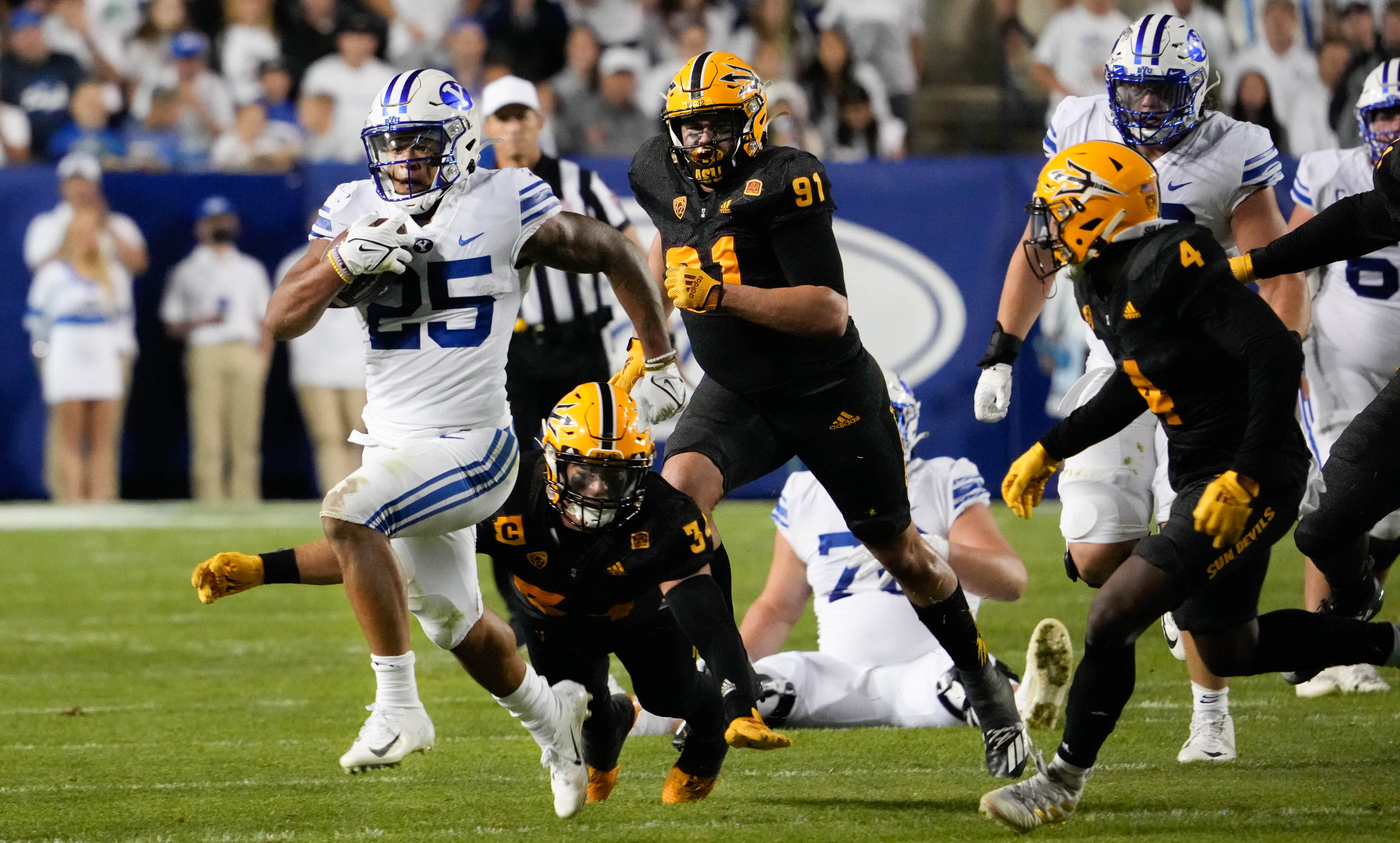 BYU running back Tyler Allgeier (25) takes knee during an NCAA college  football game against Virginia Saturday, Oct. 30, 2021, in Provo, Utah. (AP  Photo/George Frey Stock Photo - Alamy