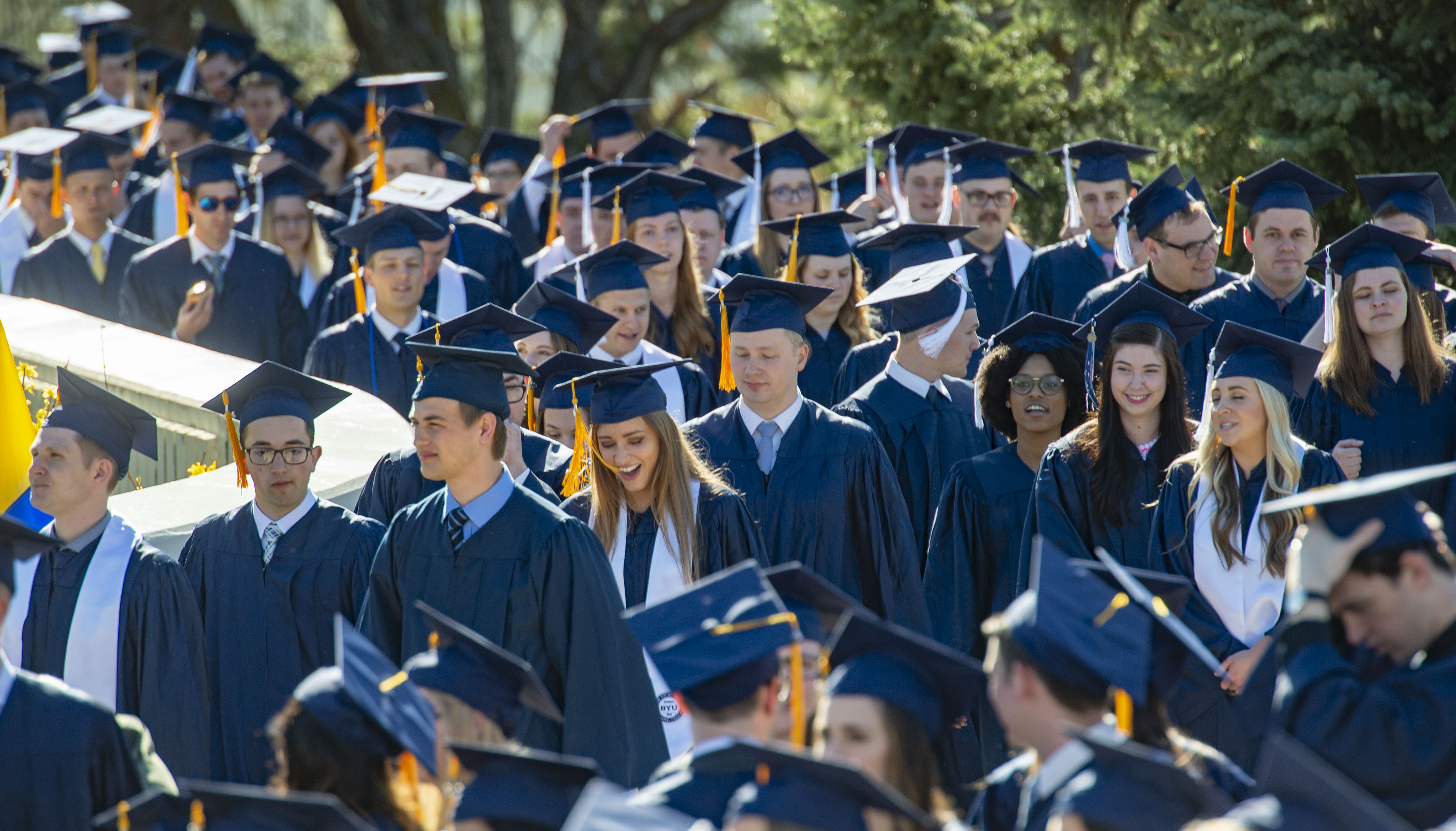 BYU graduates its biggest class ever with blue gowns, smiles and jokes about the history of the 'Y' on Provo's mountainside