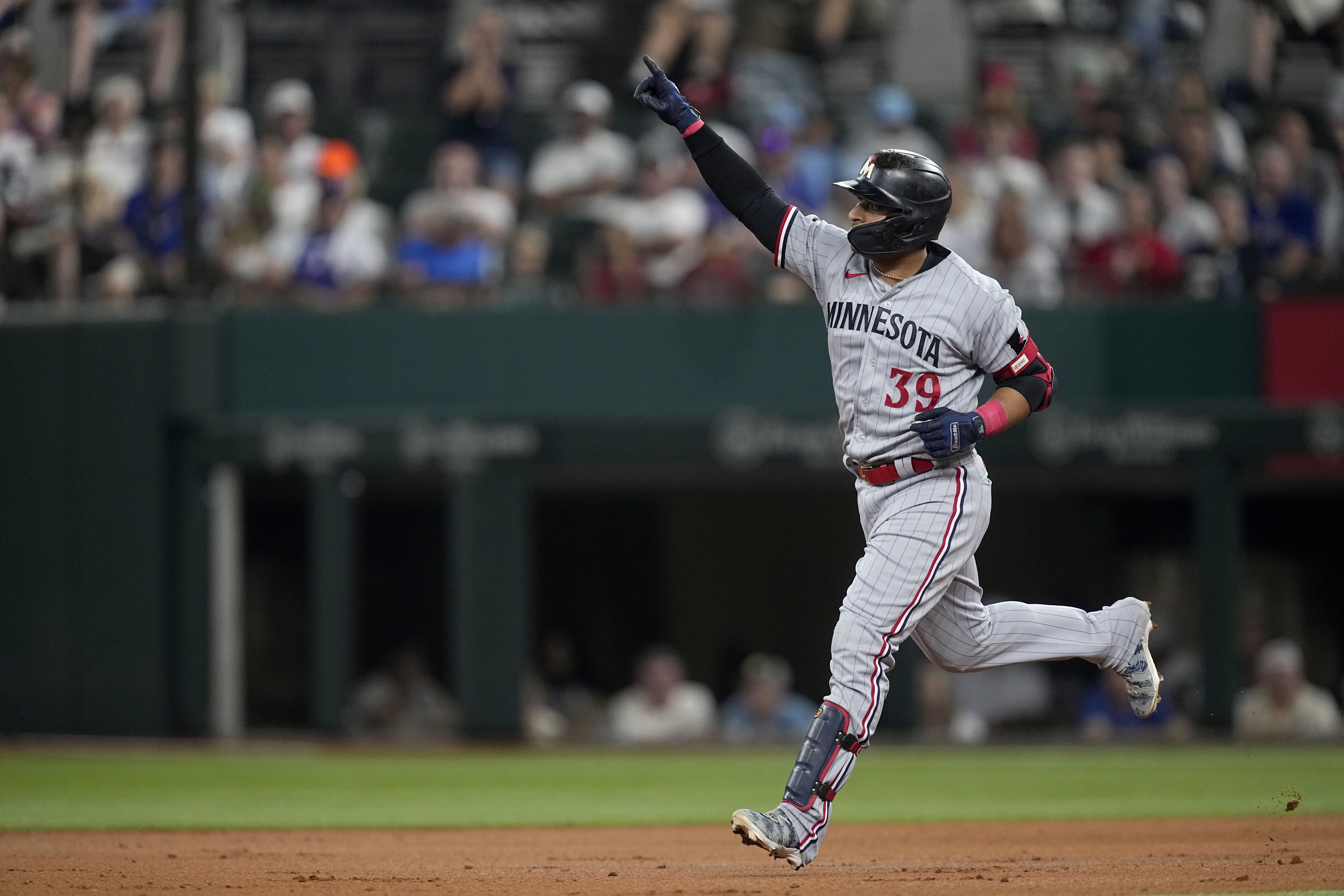 Donovan Solano puts on a show at the plate, in the field as Twins beat  Rangers in 10 innings