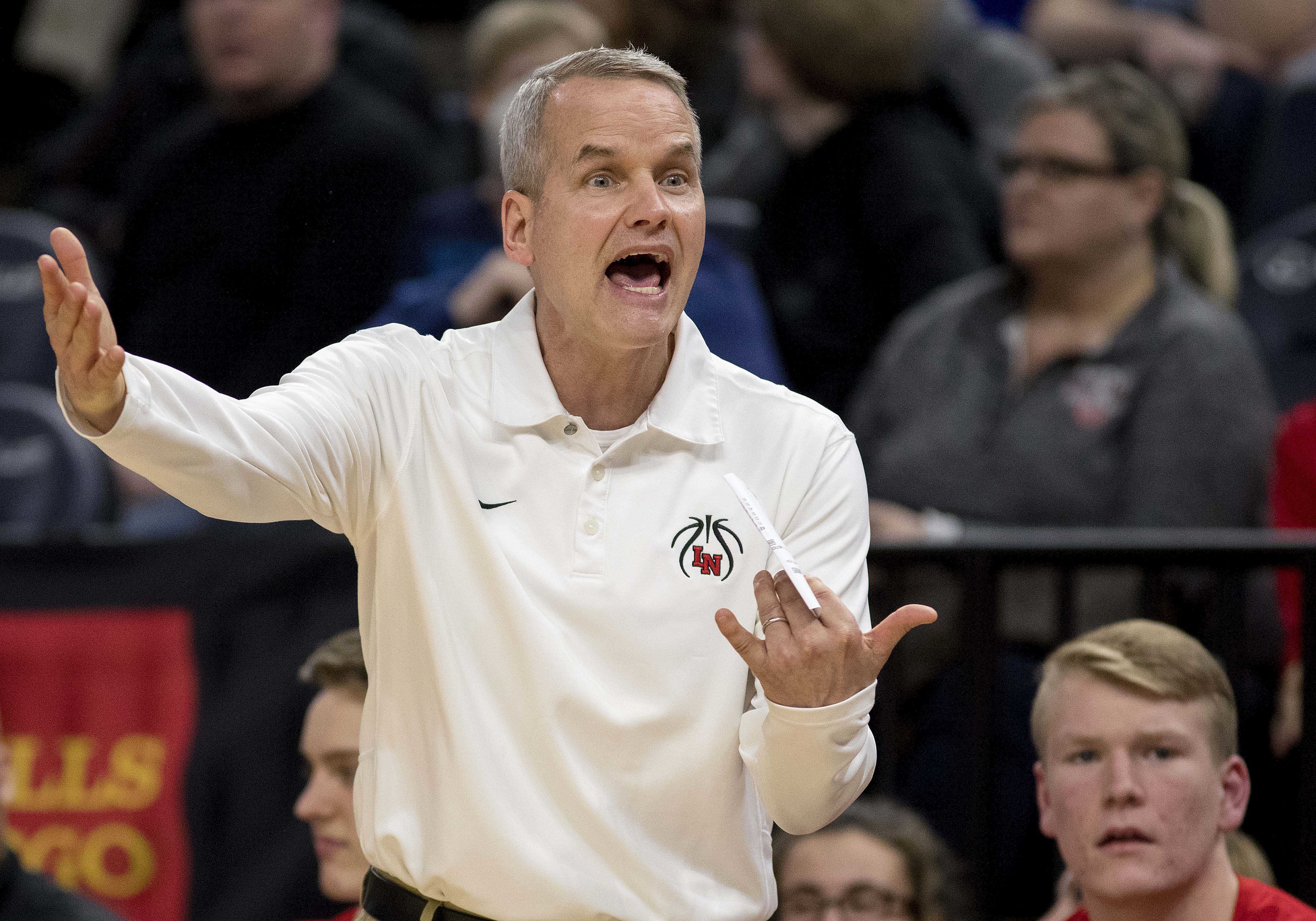 Lakeville North boys basketball coach John Oxton announces