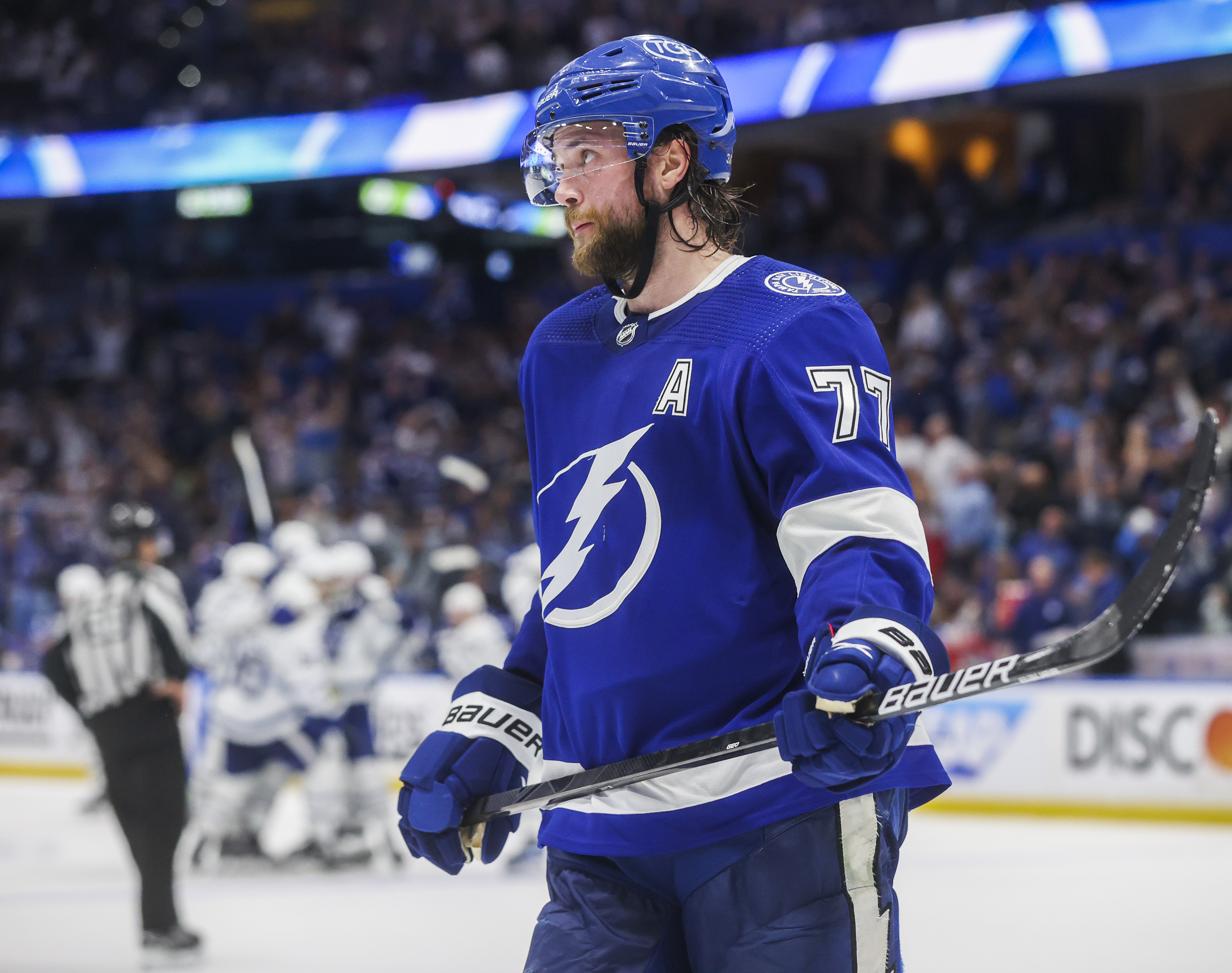 Tampa Bay Lightning center Steven Stamkos (91) is patted on the helmet by  teammate Victor Hedman (77) after scoring his third goal of the night  during the third period of an NHL