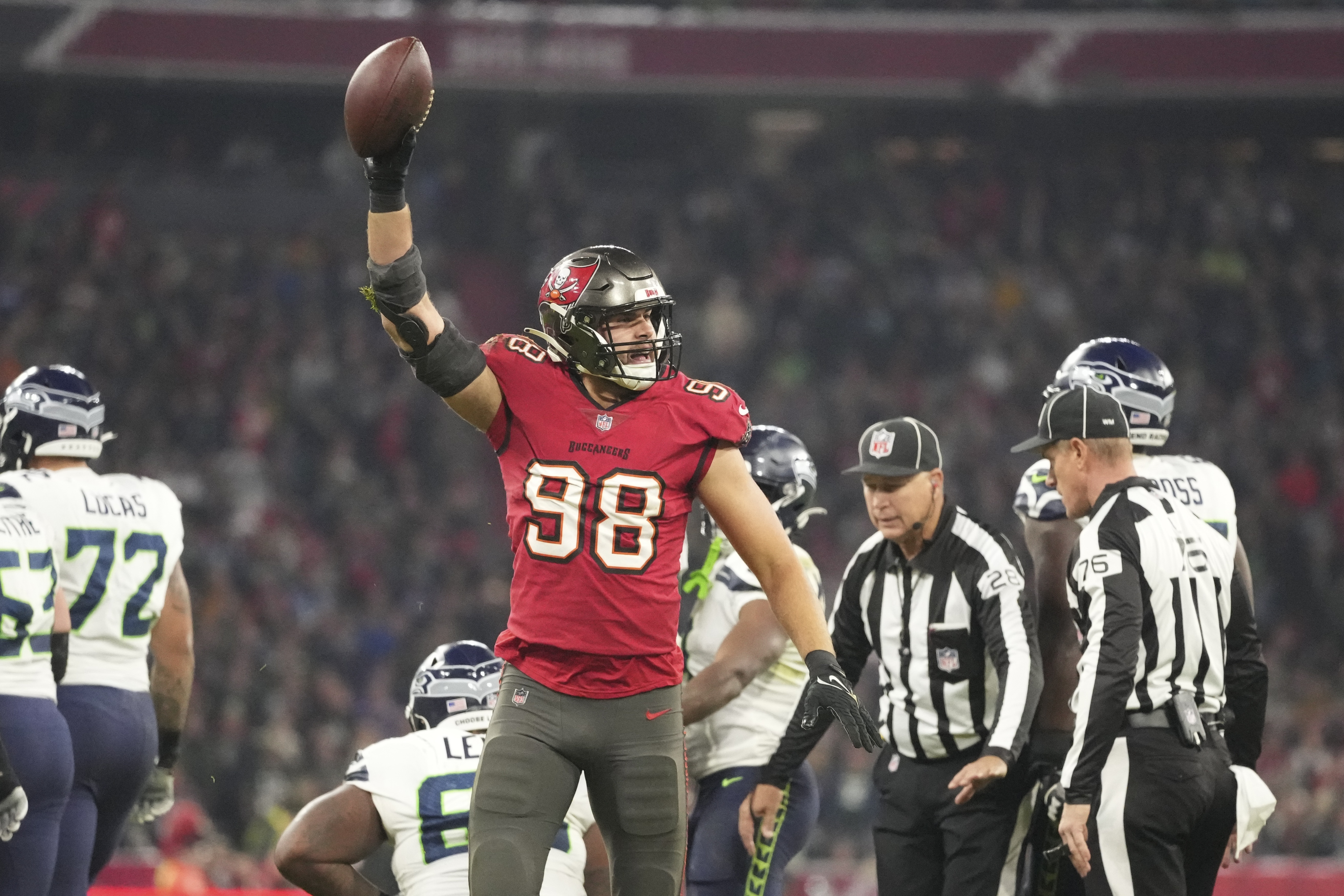 Tampa Bay Buccaneers wide receiver Mike Evans (13) stiff-arms Seattle  Seahawks safety Quandre Diggs (6) during an NFL football game on Nov. 13,  2022, in Munich. The Buccaneers defeated the Seahawks 21-16. (