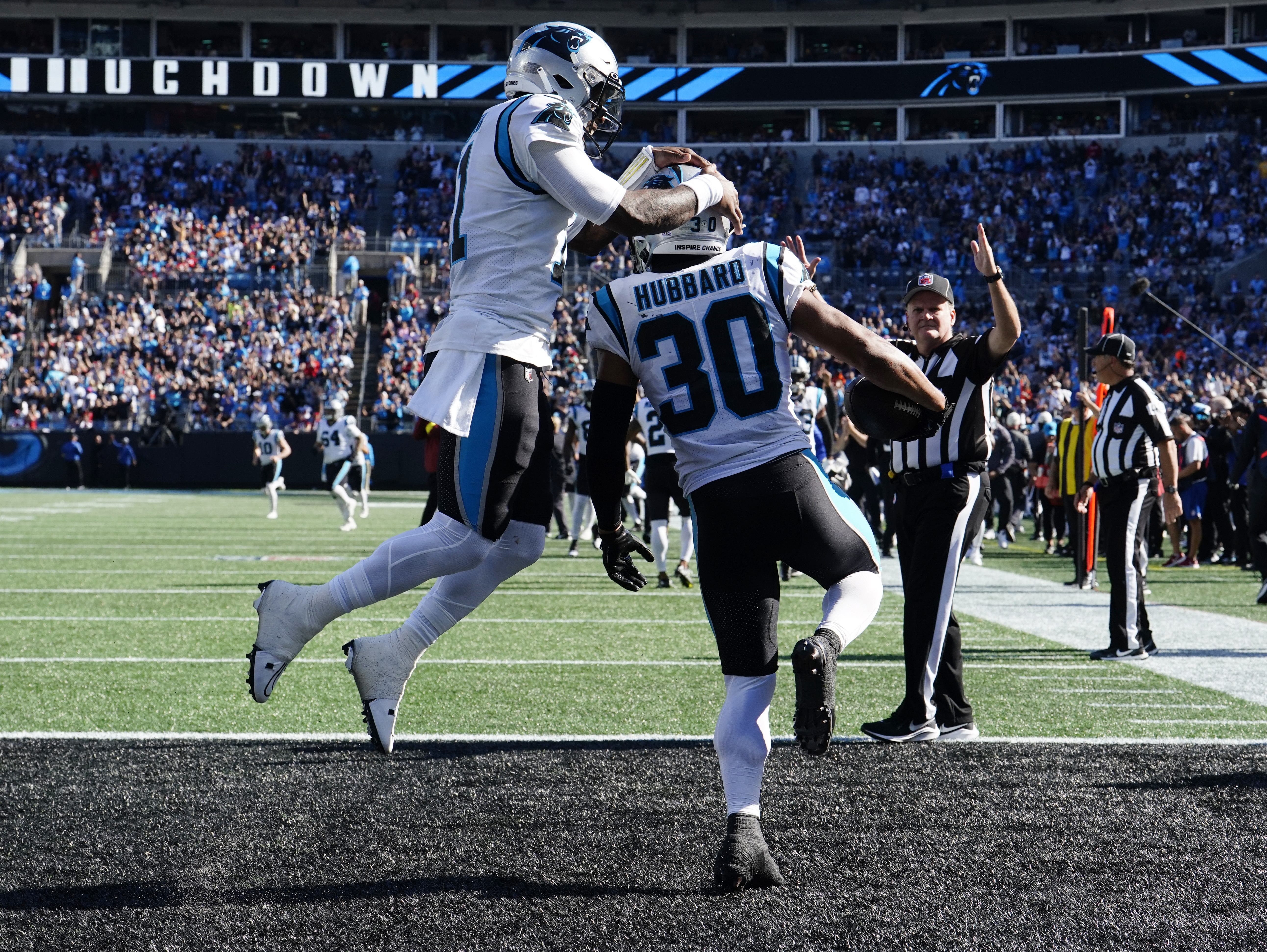 Carolina Panthers running back Chuba Hubbard (30) takes a handoff from  quarterback PJ Walker (11) during an NFL football game against the Tampa  Bay Buccaneers on Sunday, Oct. 23, 2022, in Charlotte