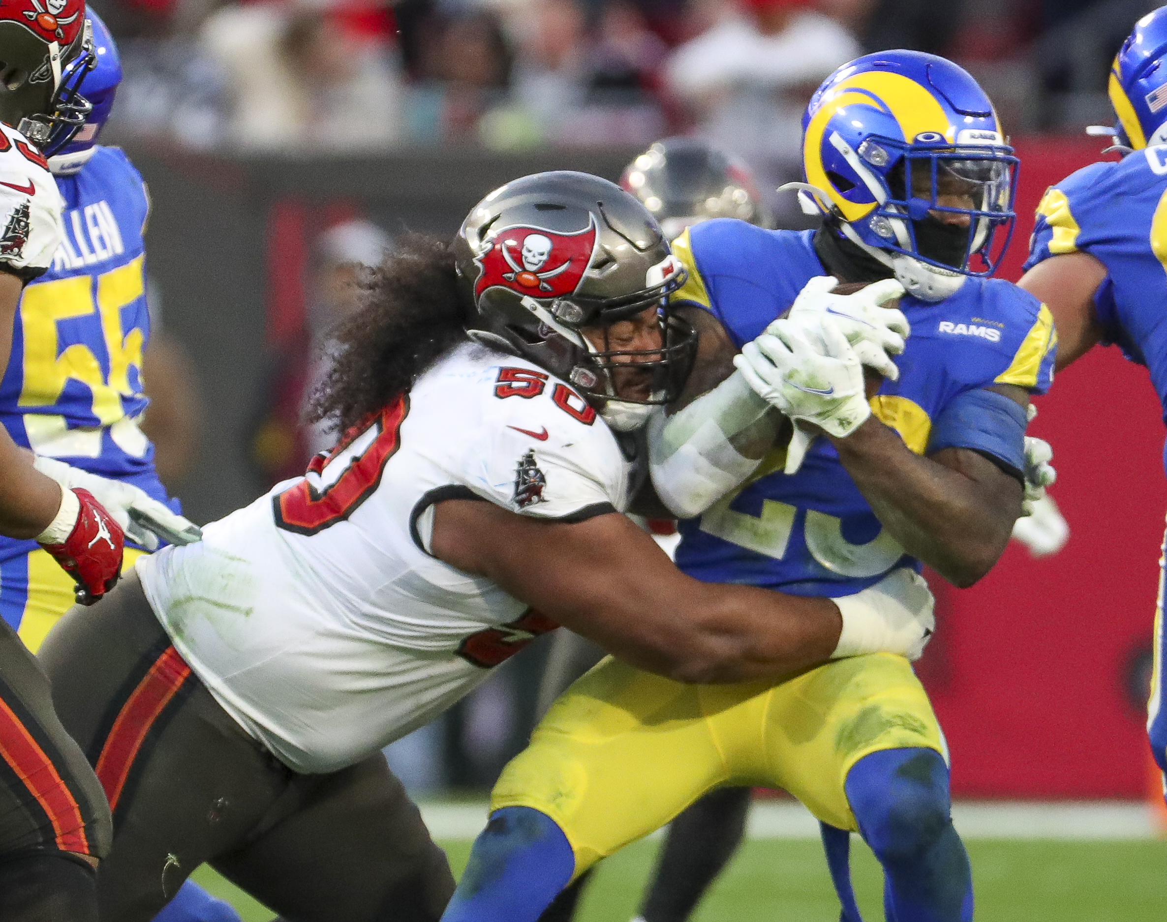 Tampa Bay Buccaneers guard Alex Cappa (65) reacts to the snap during a NFL  divisional playoff f …