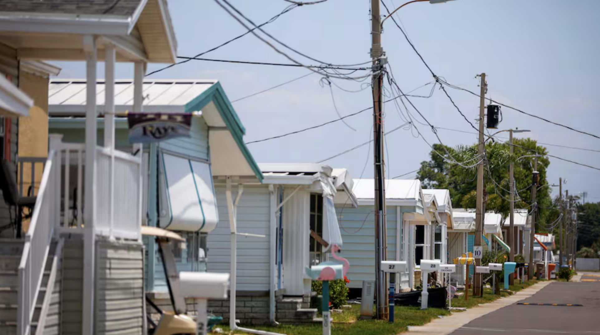 Power lines are seen along Yawl Lane at the Crystal Bay Mobile Home Club on in Palm Harbor. Elevating homes in the park could prove to be difficult due to the power lines.  