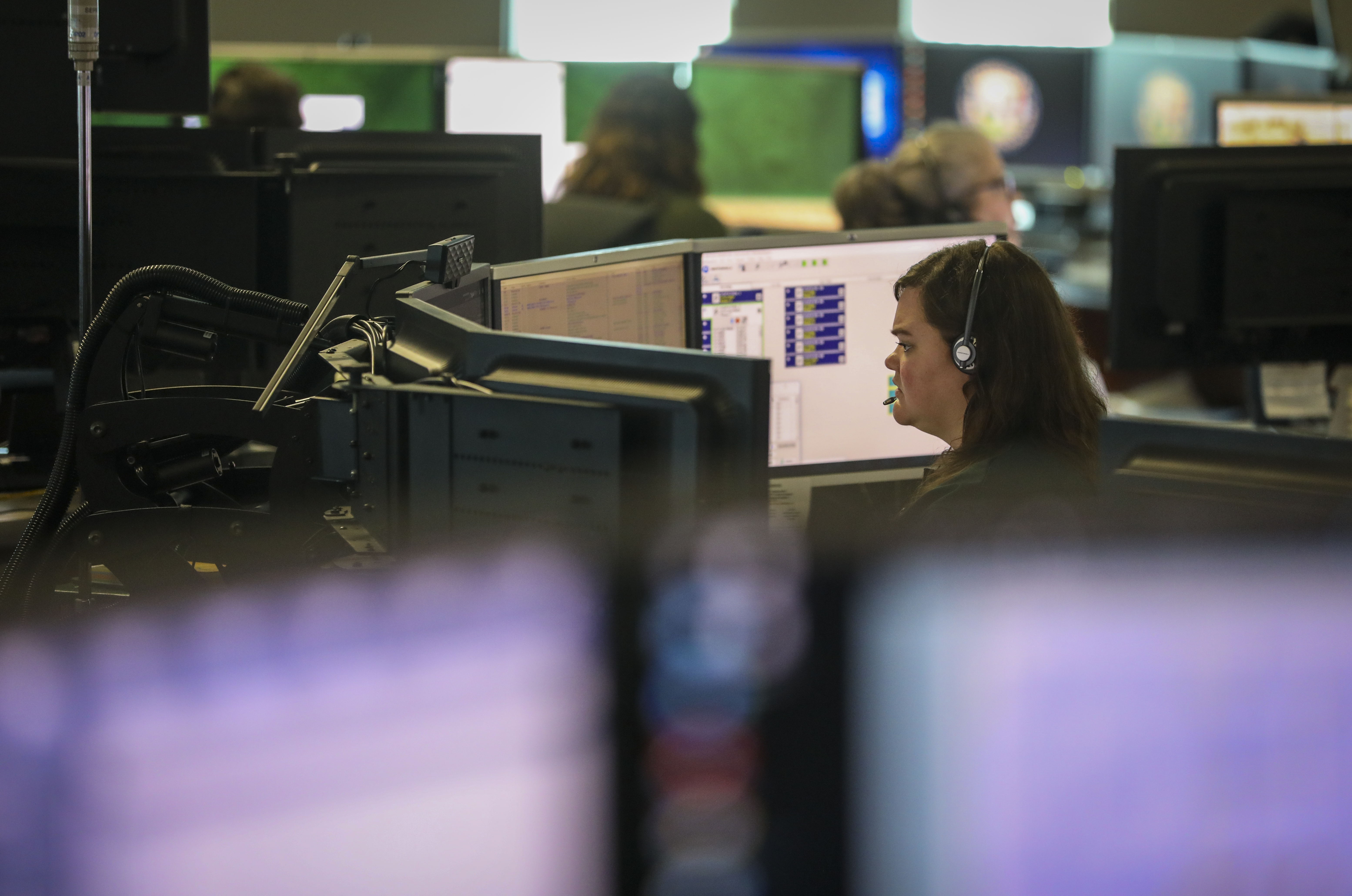 She's the invisible link between 911 callers and cops