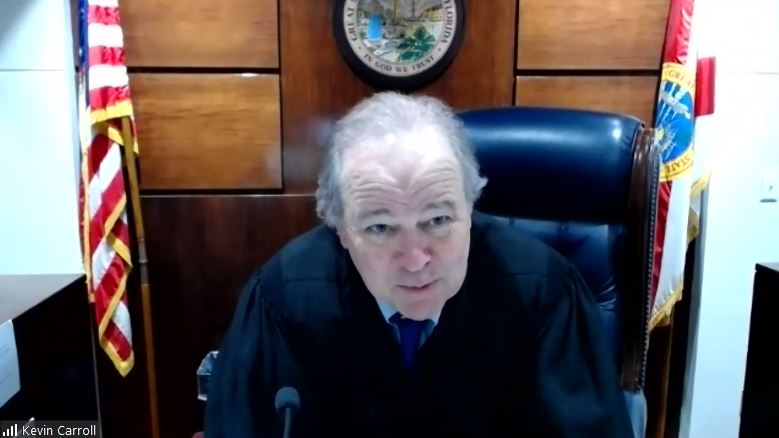 Judge Kevin Carroll, of Leon County, presided over a hearing by video conference Monday in a lawsuit over climate change brought by eight children against state officials. [Screenshot from Zoom]