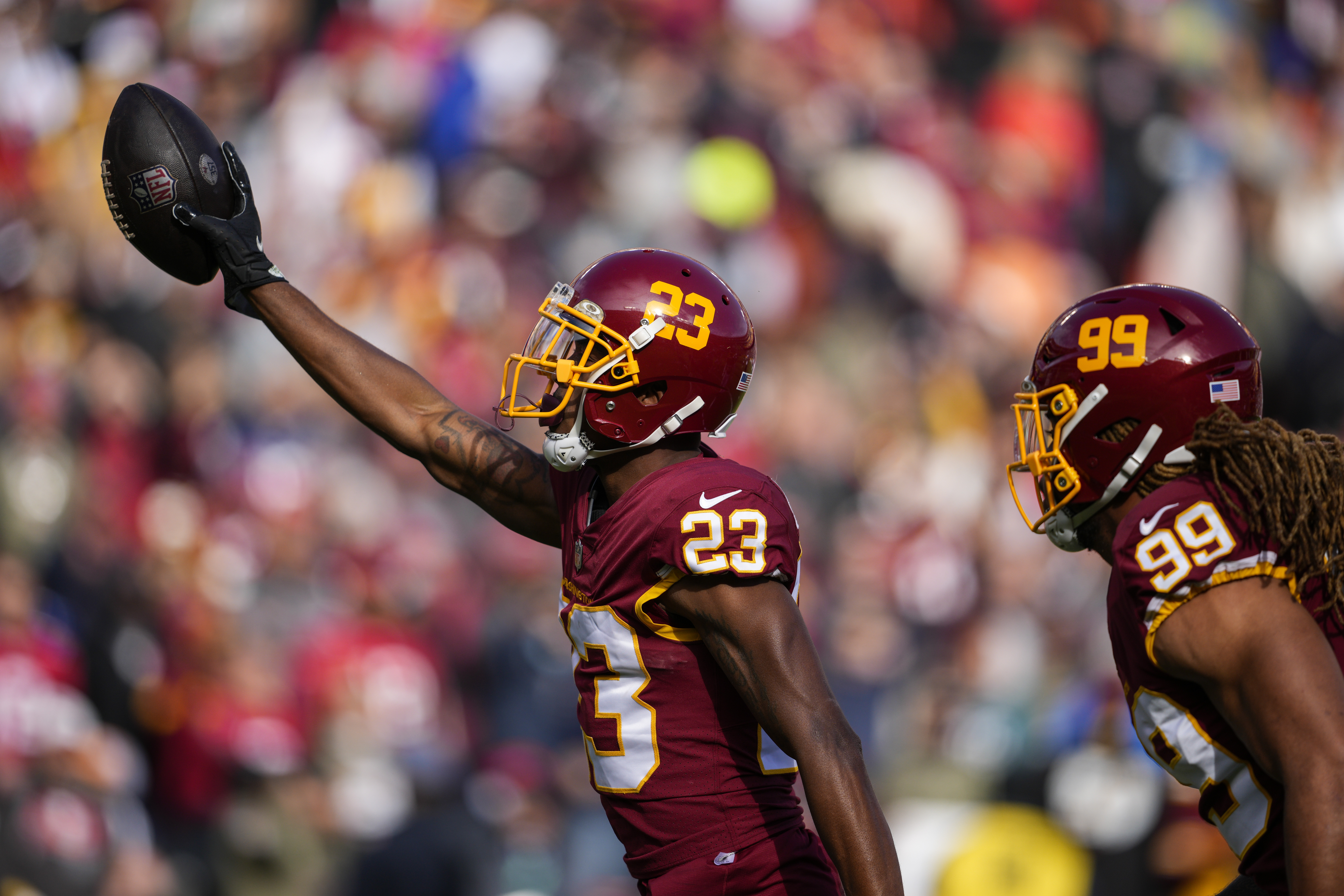 Nov 14, 2021; Landover, MD USA; Washington Football Team quarterback Taylor  Heinicke (4) celebrates after running back Antonio Gibson (24) scores a  touchdown that sealed the victory against the Tampa Bay Buccaneers