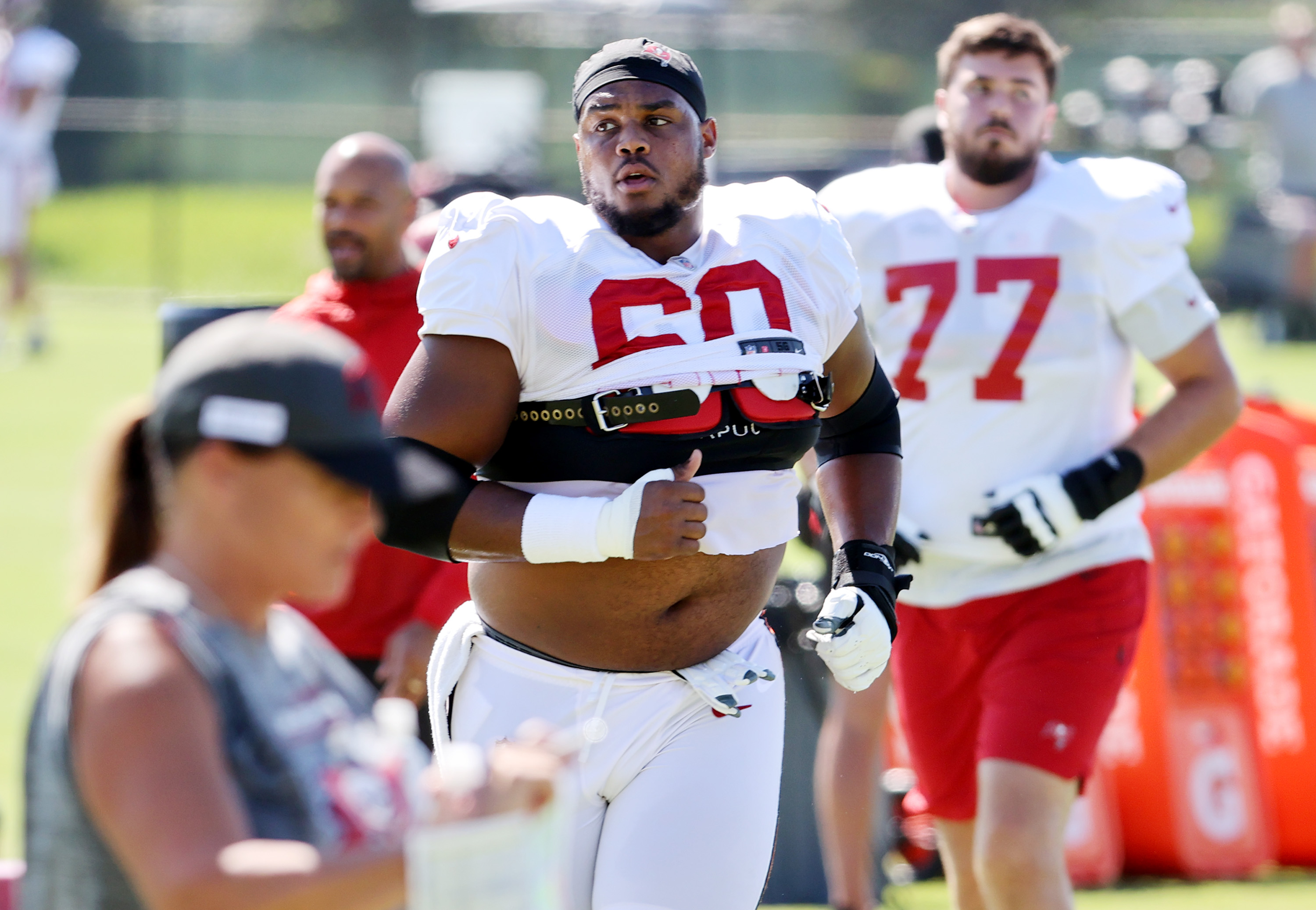 Tampa Bay Buccaneers guard Nick Leverett (60) prays before an NFL football  game against the Atlanta Falcons, Sunday, Dec. 5, 2021, in Atlanta. The Tampa  Bay Buccaneers won 30-17. (AP Photo/Danny Karnik