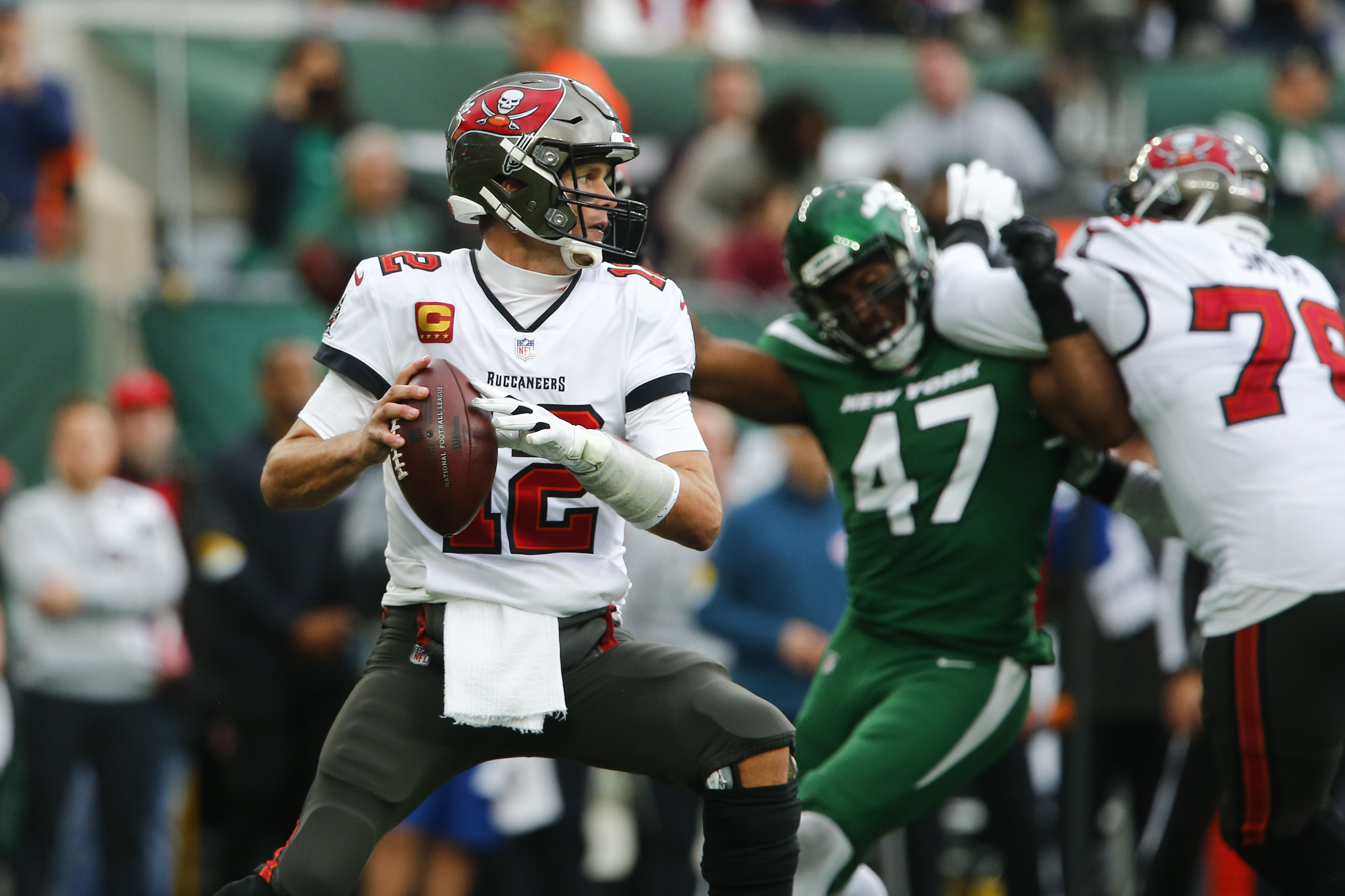 New York Jets running back Michael Carter (32) warms up before taking on  the Miami Dolphins during an NFL football game Sunday, Oct. 9, 2022, in  East Rutherford, N.J. (AP Photo/Adam Hunger