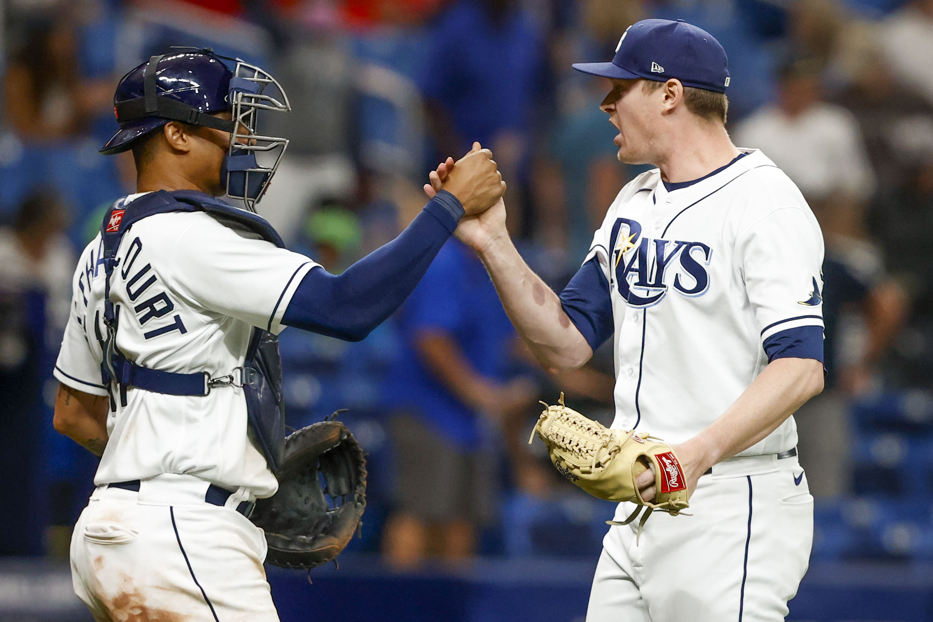 Tampa Bay Rays catcher Christian Bethancourt celebrates with relief pitcher  Pete Fairbanks (29) after they defeated the Texas Rangers during a baseball  game, Sunday, Sept. 18, 2022, in St. Petersburg, Fla. (AP