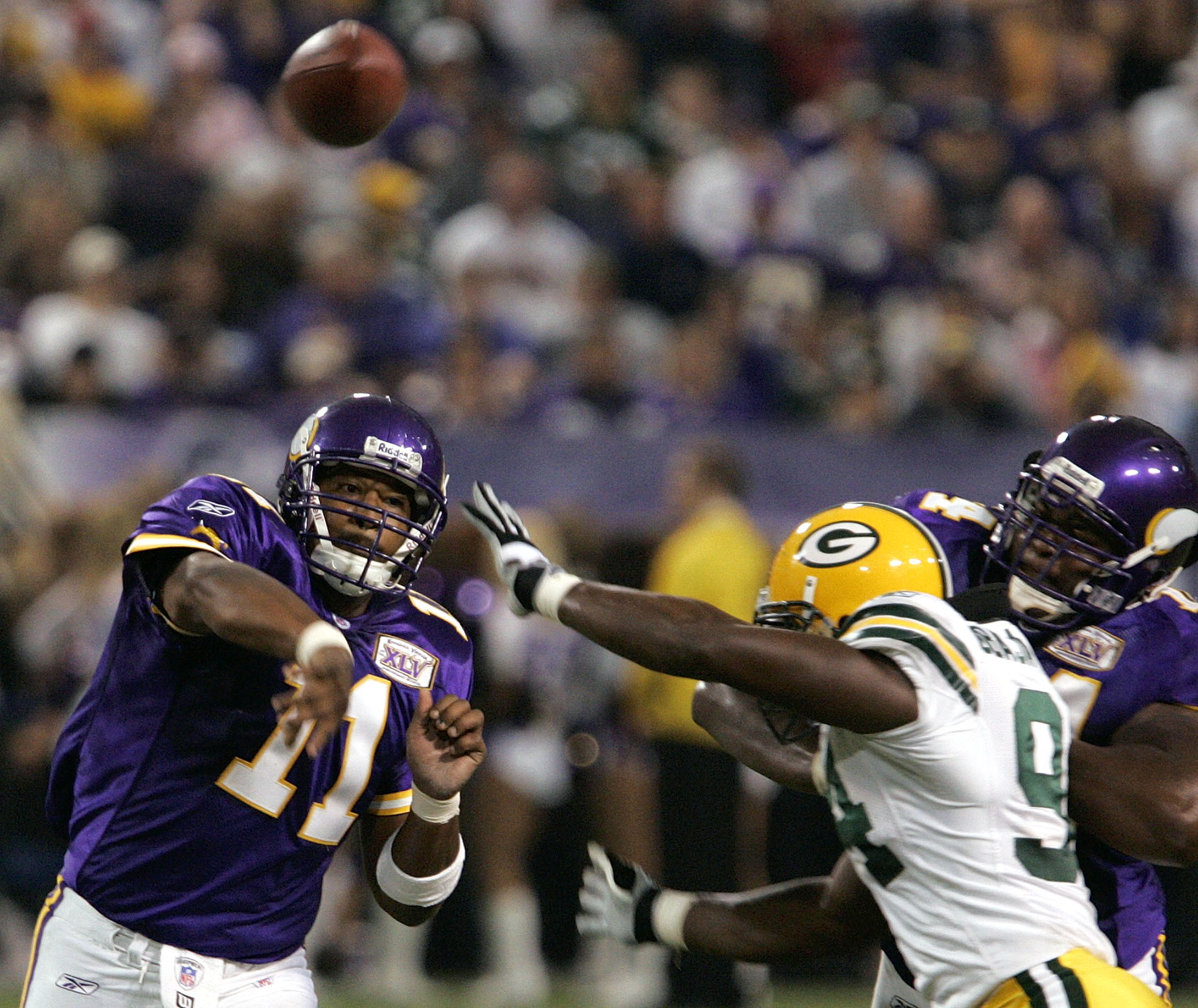 Minnesota Viking quarterback Warren Moon of the NFC team stands on