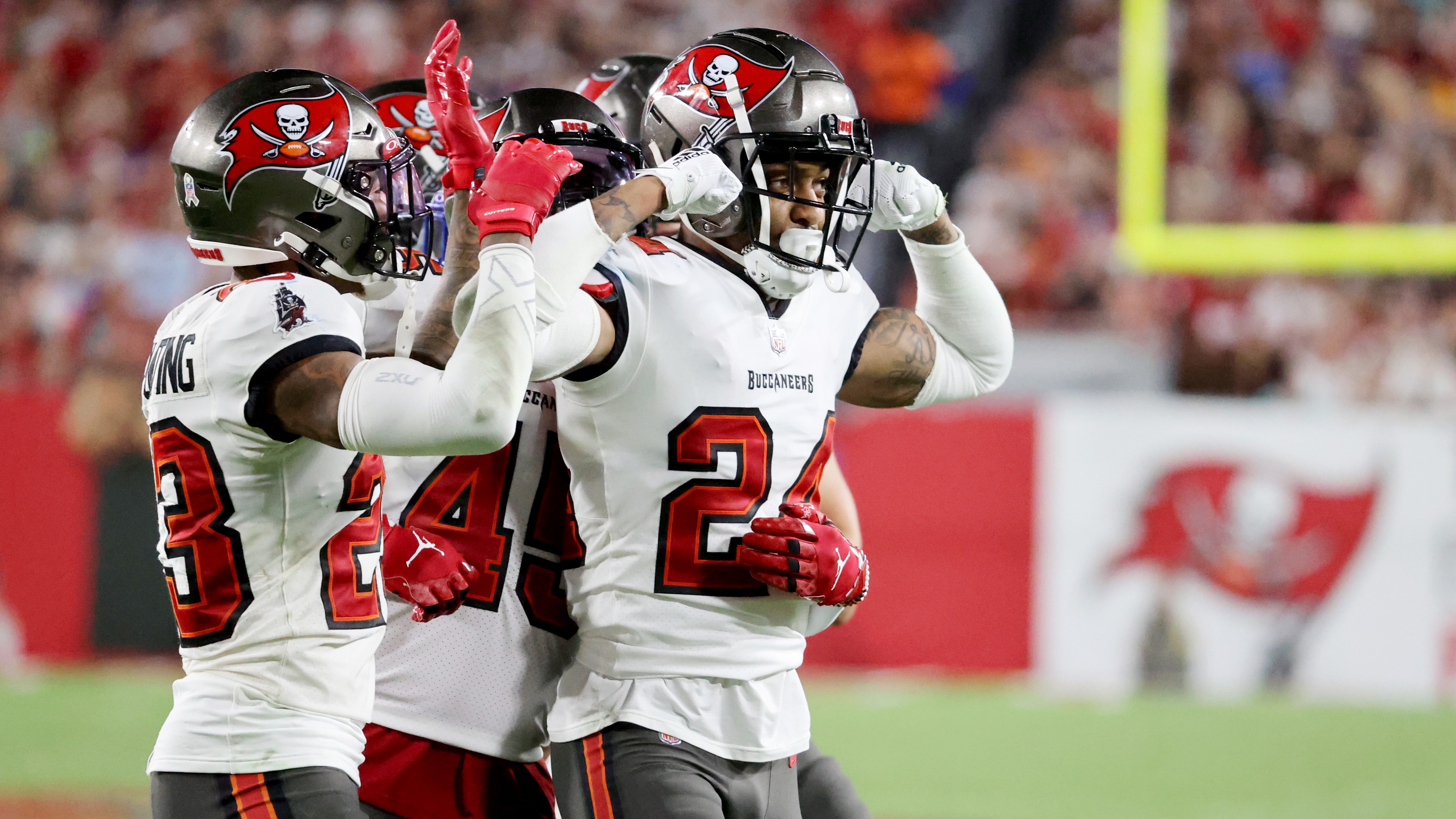 Tampa Bay Buccaneers defensive tackle Rakeem Nunez-Roches (56) with a smart  phone celebrating after an NFL football game against the Seattle Seahawks  on Nov. 13, 2022, in Munich. The Buccaneers defeated the