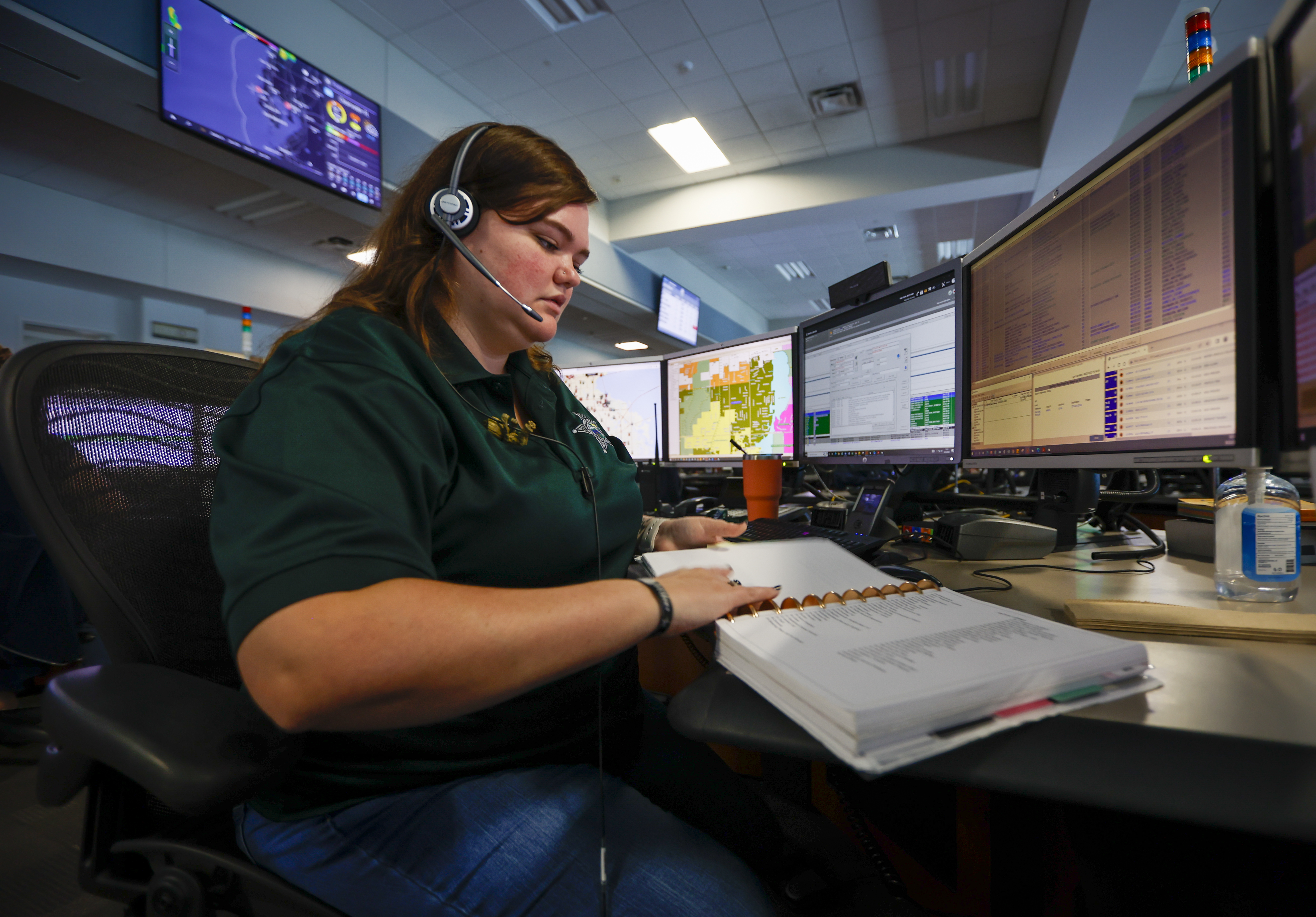 She's the invisible link between 911 callers and cops