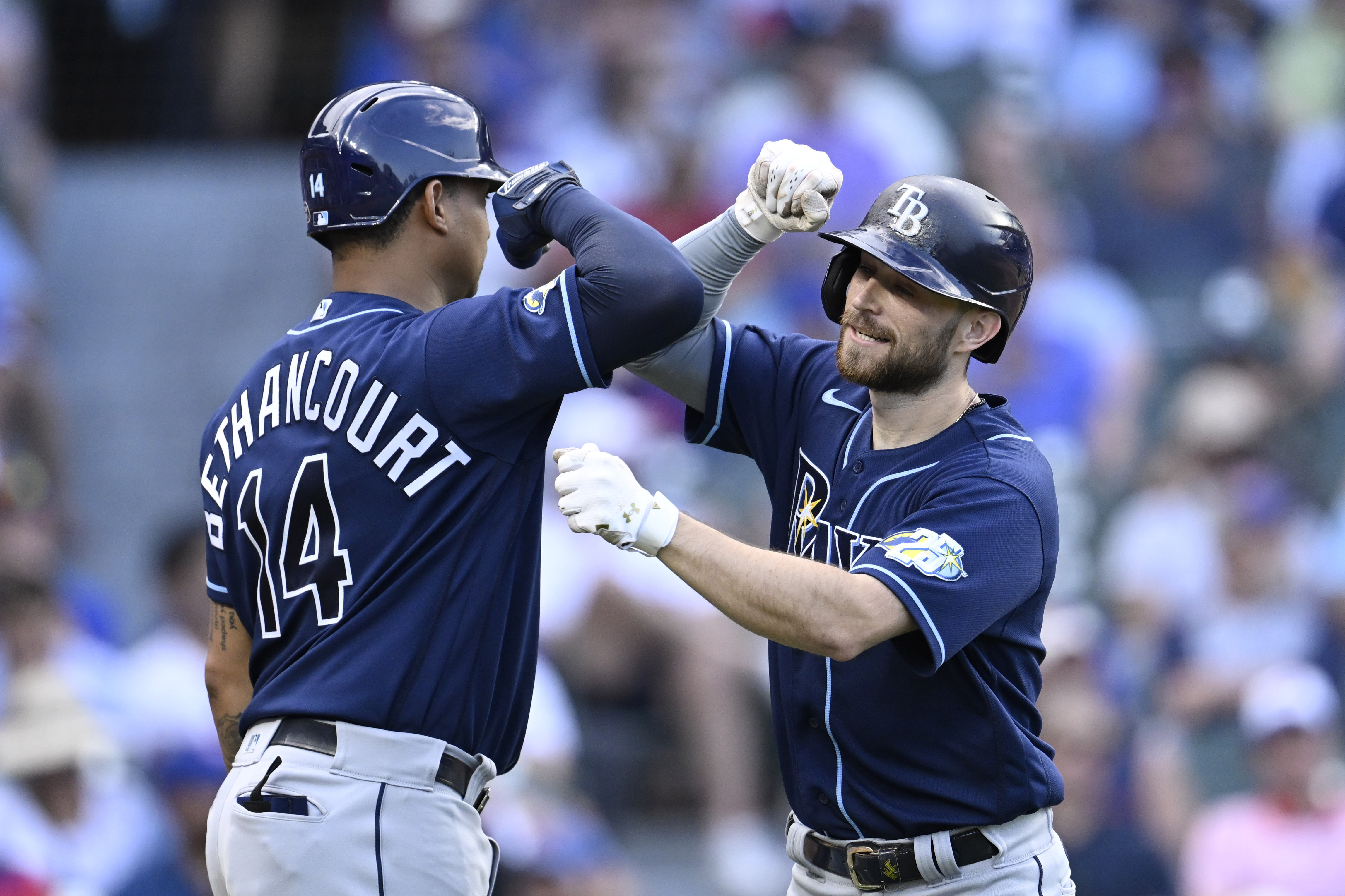 Rays find some power late, beat Cubs to avoid sweep