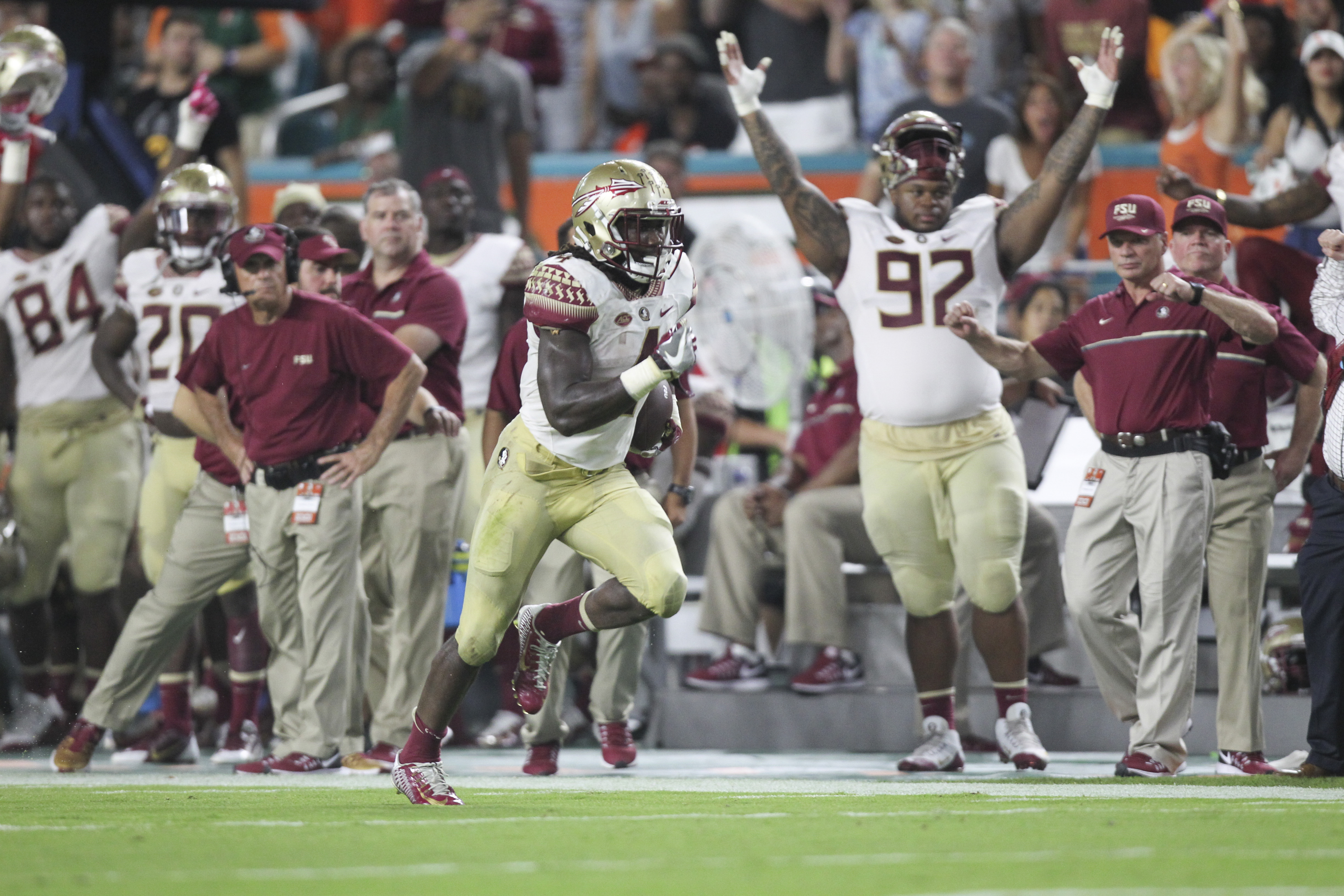 NFL draft: Travis Etienne is a bigger Barry Sanders, USF football's Jeff  Scott says