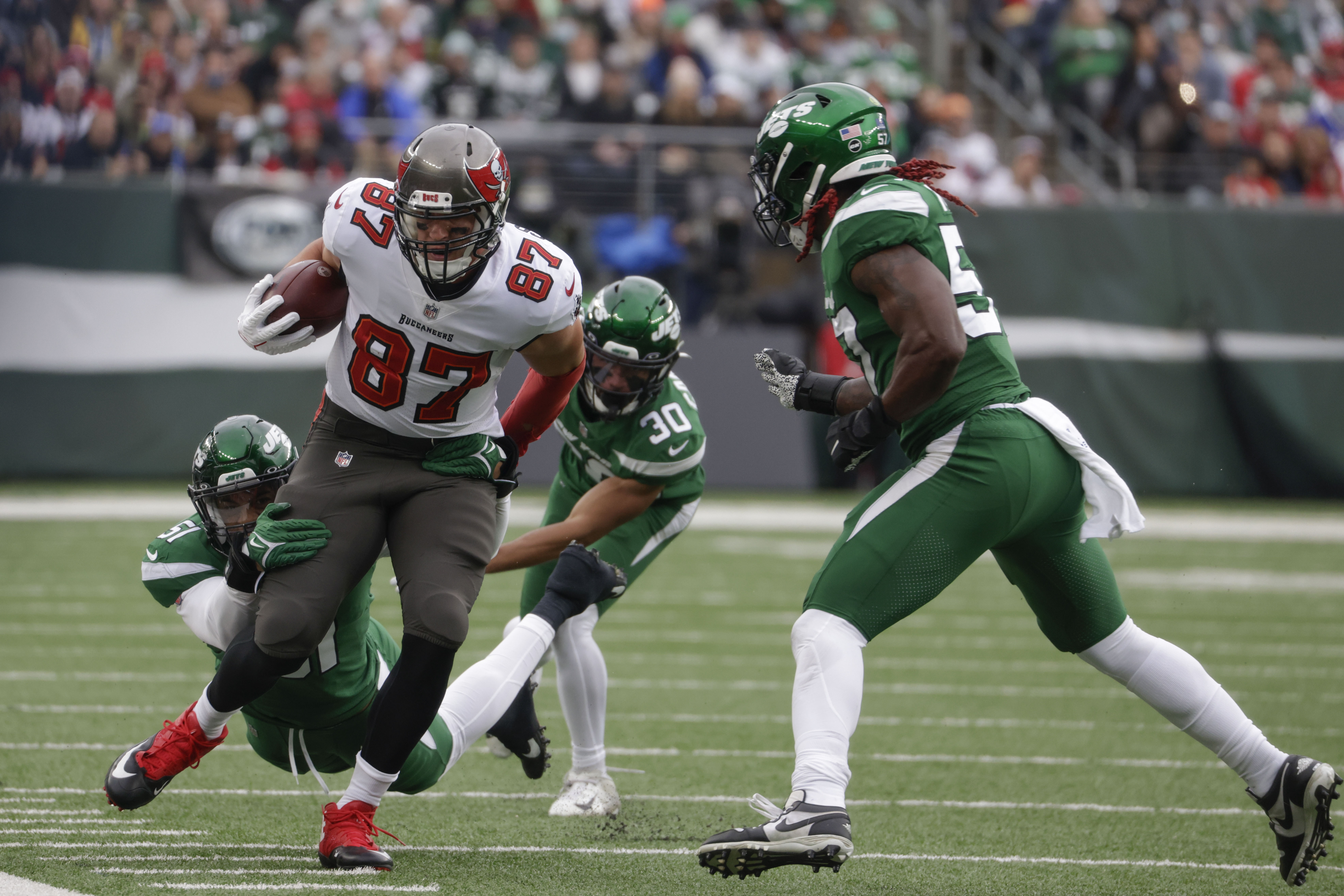 New York Jets running back Michael Carter (32) warms up before taking on  the Miami Dolphins during an NFL football game Sunday, Oct. 9, 2022, in  East Rutherford, N.J. (AP Photo/Adam Hunger