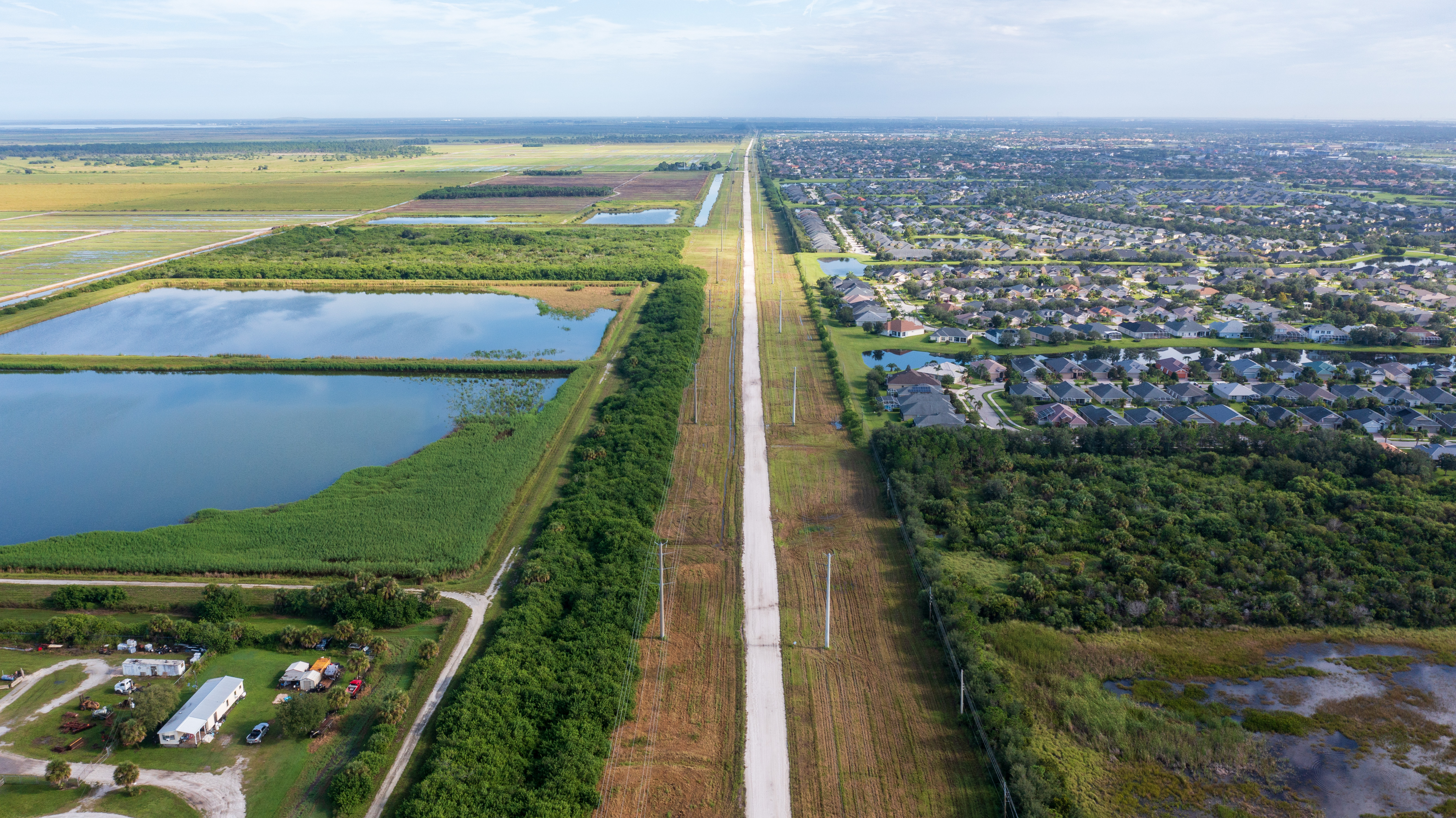 An aerial view shows a sod farm on the left and tracts of homes in Viera, capturing two dominant industries in the Sunshine State: agriculture and development. 