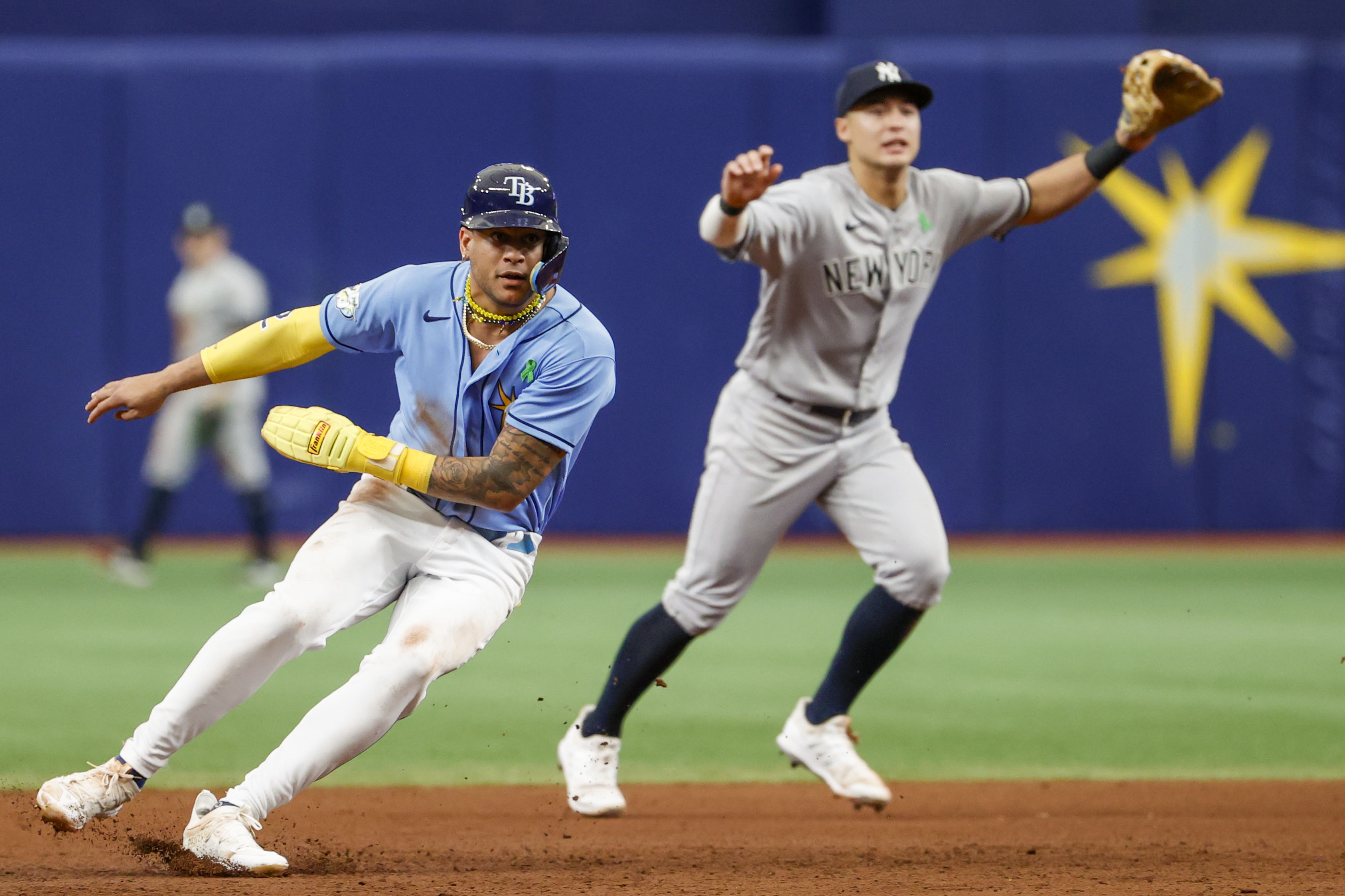 Tampa Bay Rays' Isaac Paredes, left, and Jose Siri celebrate a 8-7 win  during a