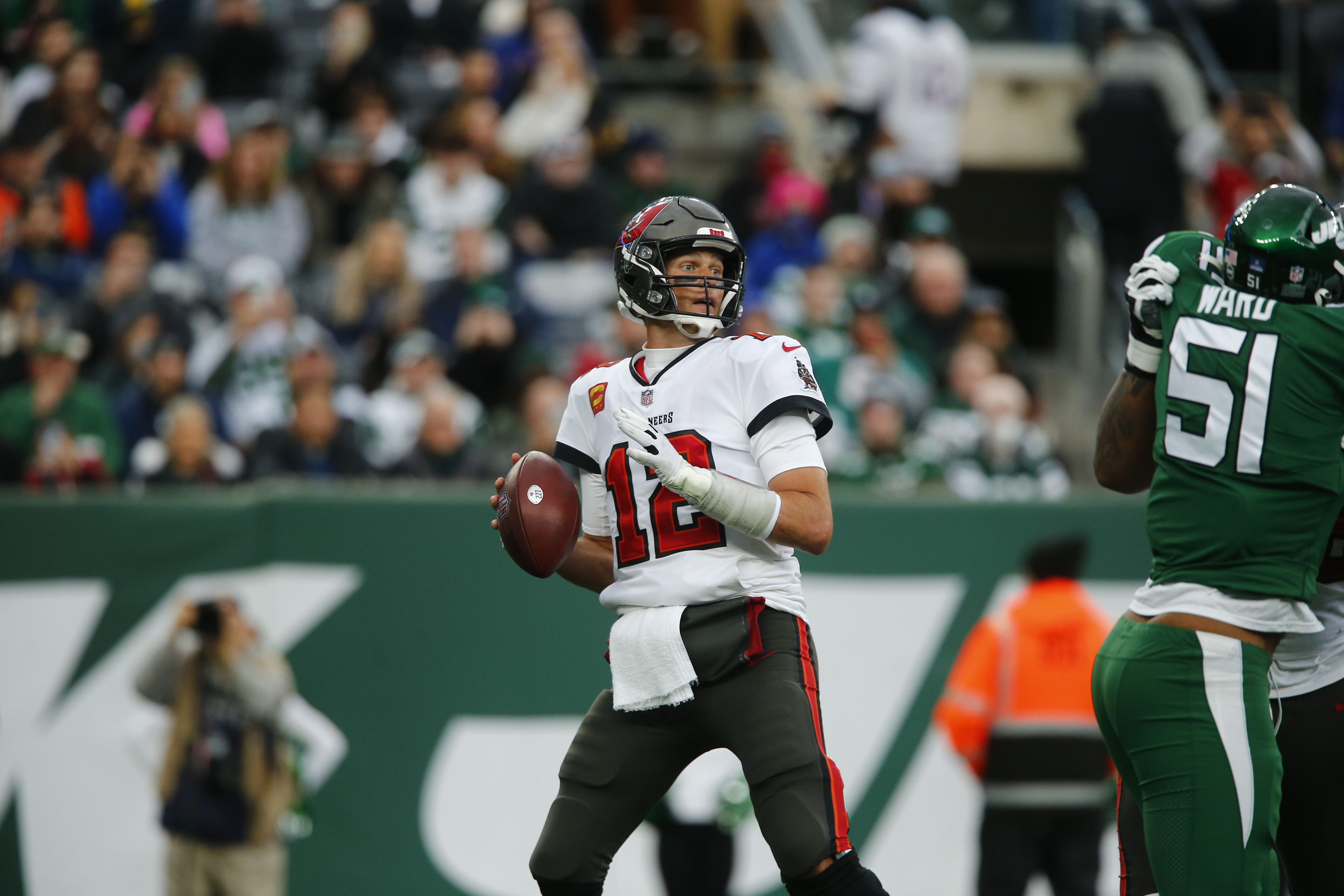 New York Jets running back Michael Carter (32) warms up before taking on  the Miami Dolphins during an NFL football game Sunday, Oct. 9, 2022, in  East Rutherford, N.J. (AP Photo/Adam Hunger